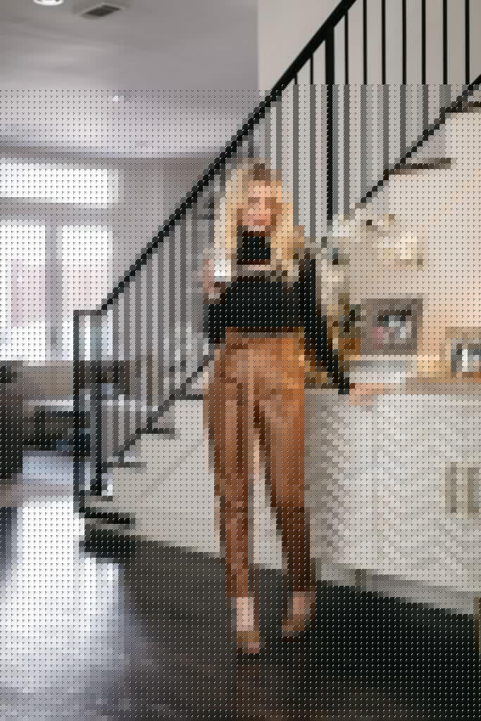 Style blogger sharing favorite home gifts from Bloomingdales and wearing faux leather pants