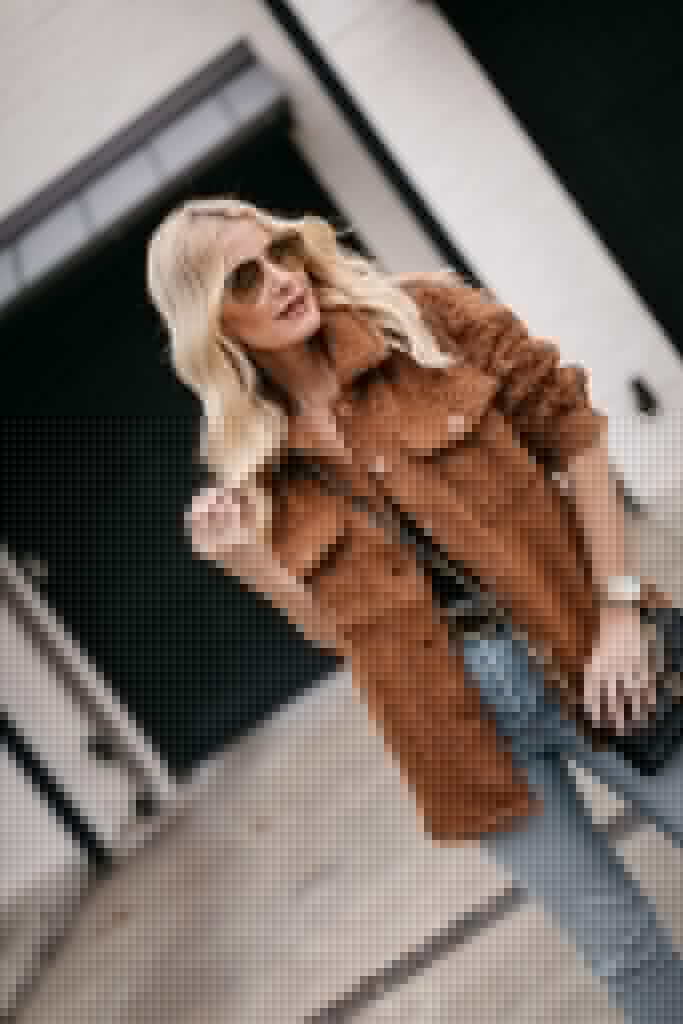 Dallas fashion blogger wearing a faux fur teddy coat and a black bodysuit with light wash denim for winter