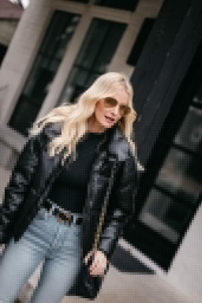 Dallas style blogger wearing a black bodysuit and a black puffer jacket for winter