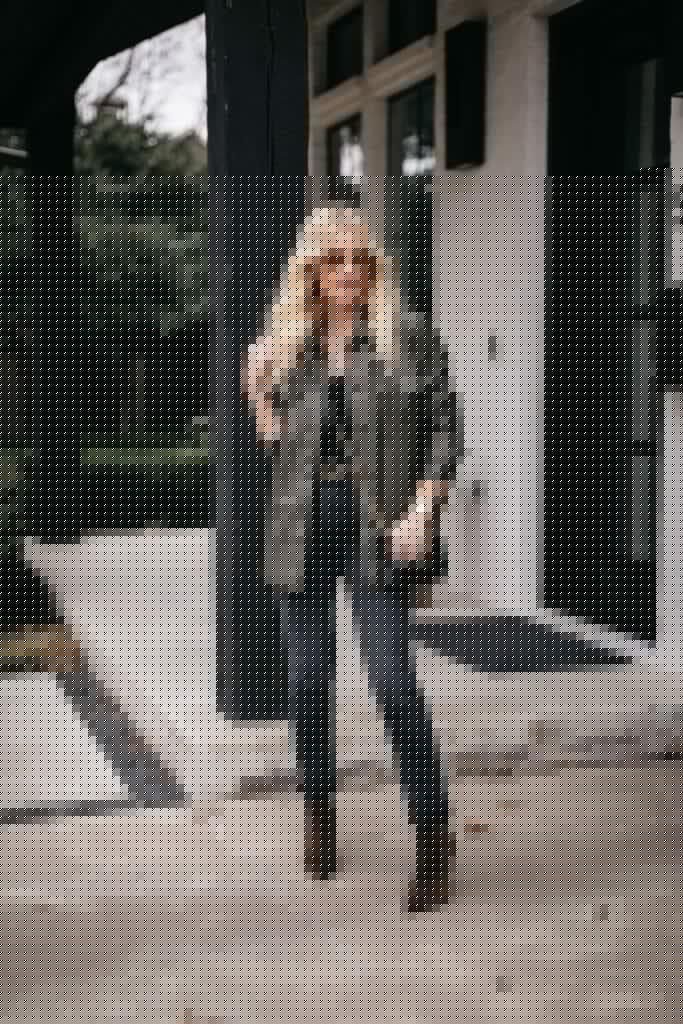 Fashion blogger wearing Redone black denim and a faux leather shirt jacket
