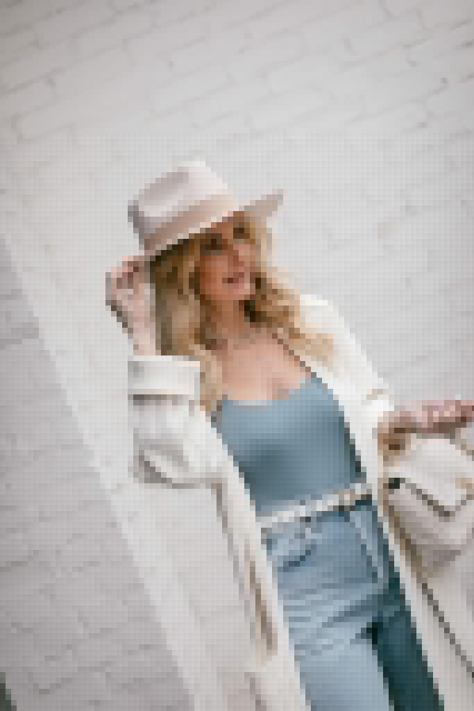 Dallas fashion blogger wearing a light blue bodysuit and a cream colored hat for spring
