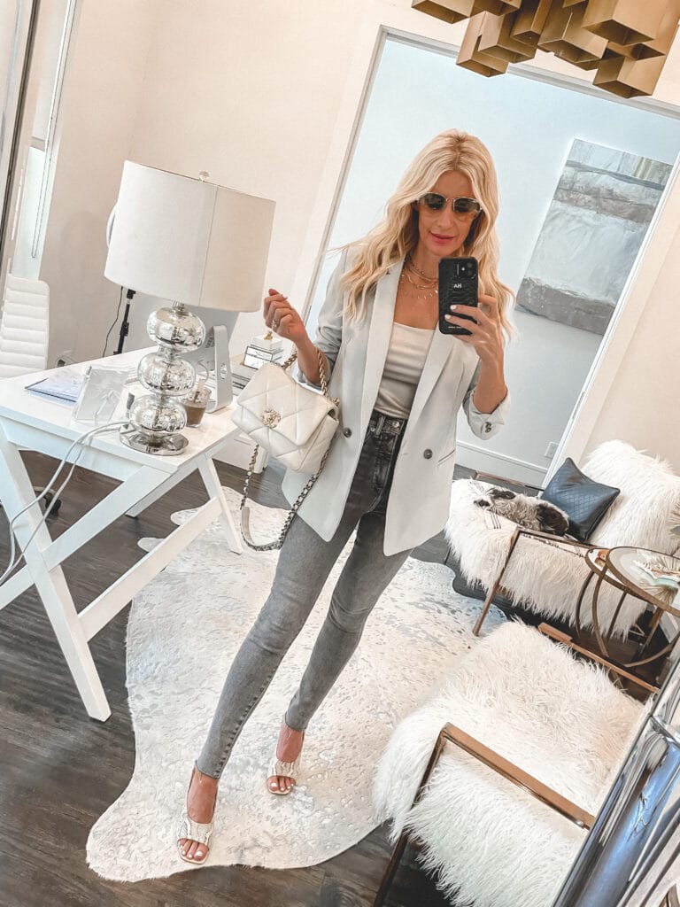 Dallas style blogger wearing grey denim and a light blue blazer for spring and Summer