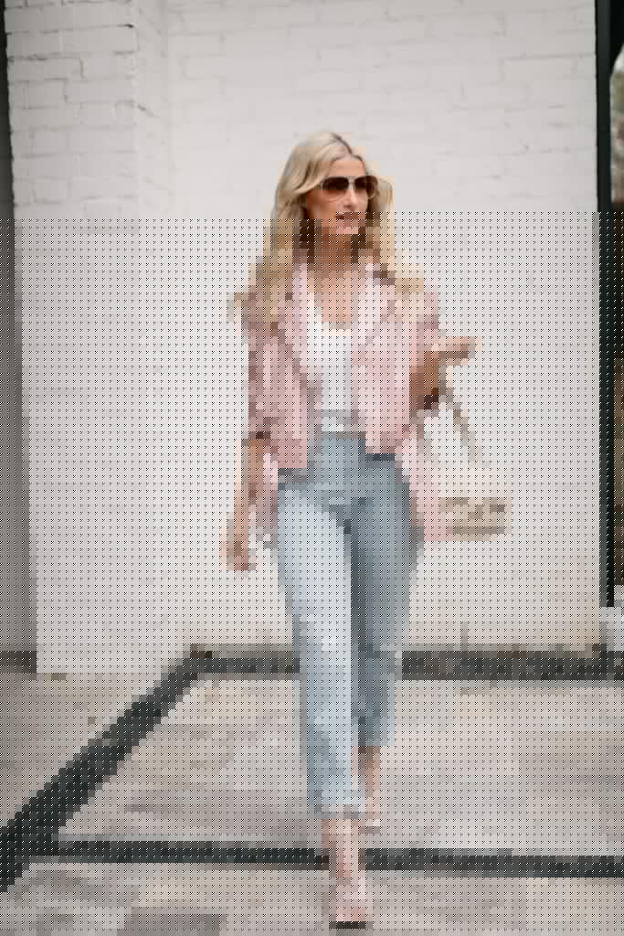 Dallas blogger wearing a white bodysuit and light wash denim for spring