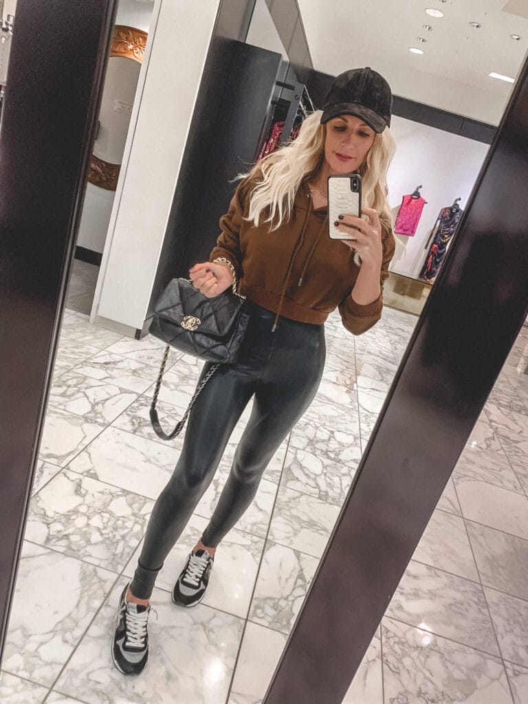 Dallas fashion blogger wearing a brown hoodie and faux leather leggings for working out