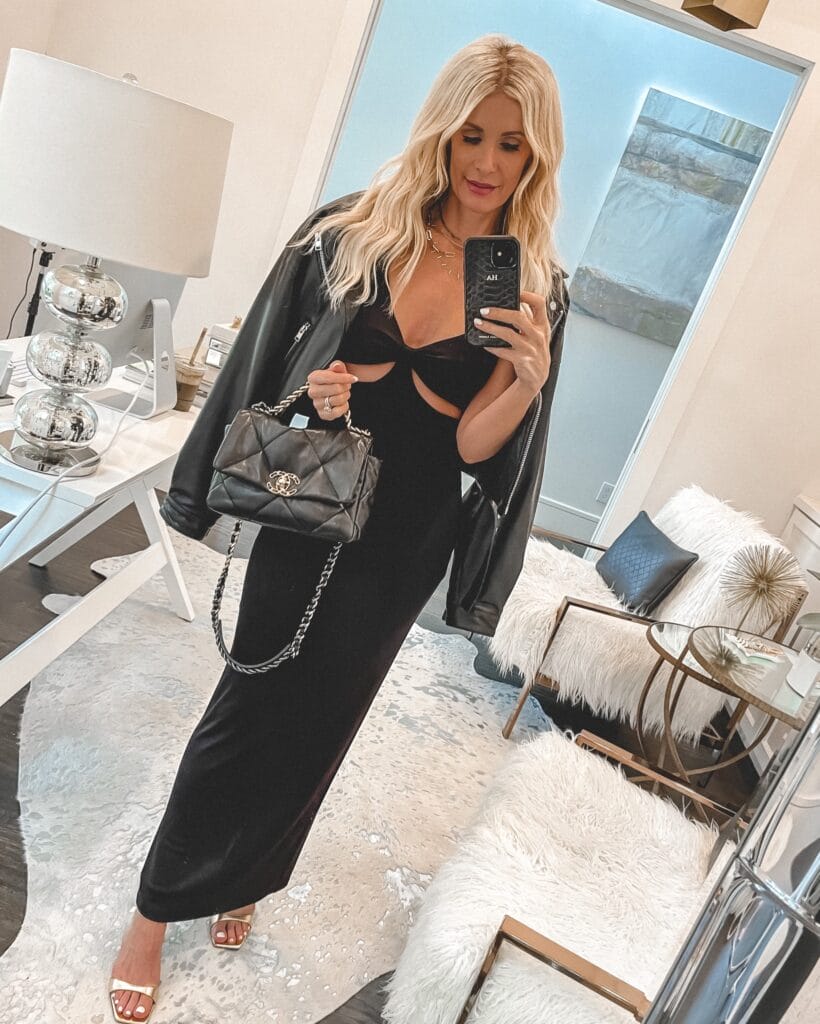 Dallas style blogger wearing a edgy black cut out dress and a leather jacket for date night