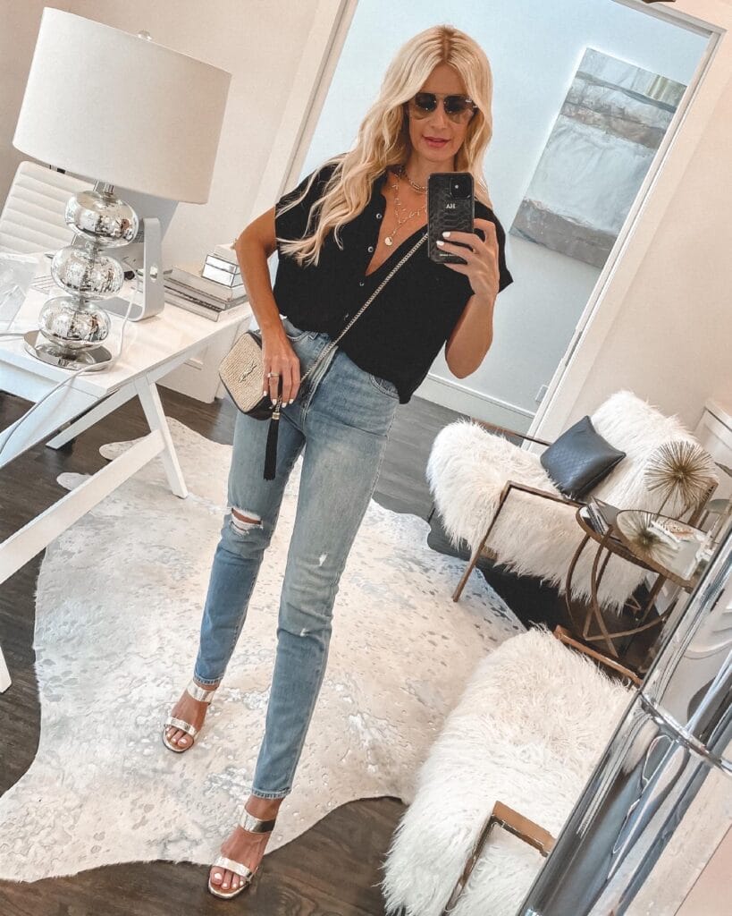 Dallas style blogger wearing a black short-sleeve shirt and gold heels
