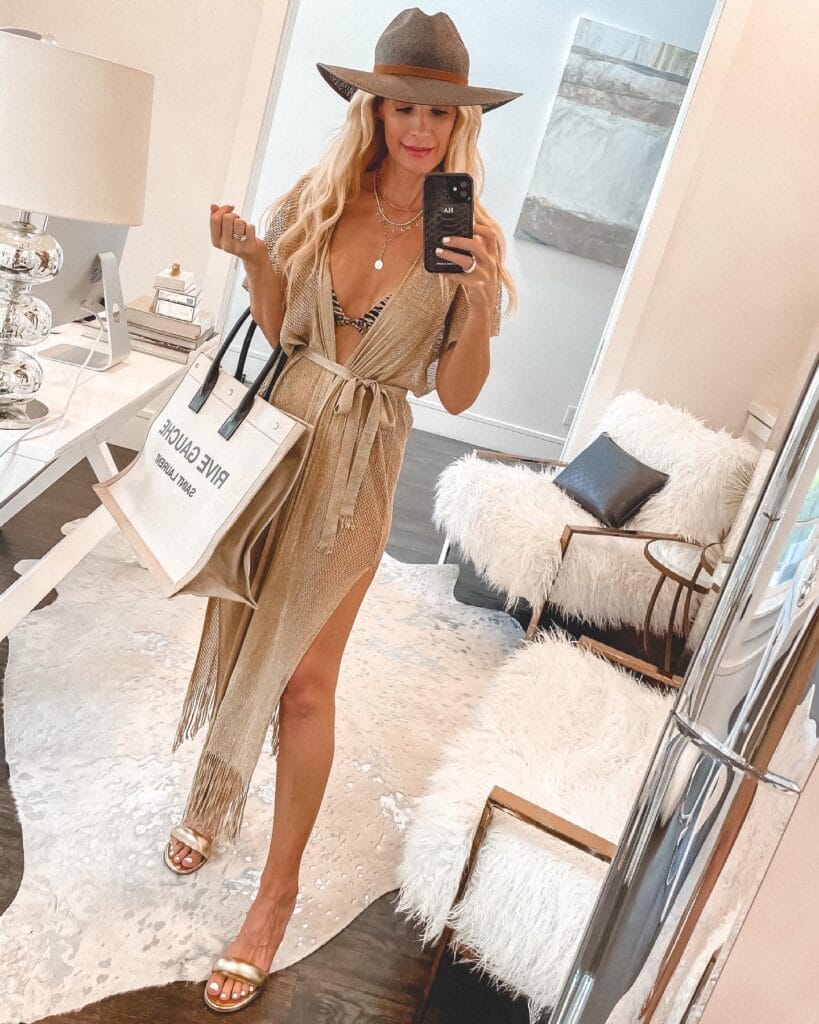 Dallas blogger wearing a wrap cover-up and a neutral straw hat