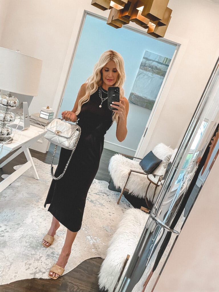 So Heather Blog wearing a black midi dress and a handbag for summer