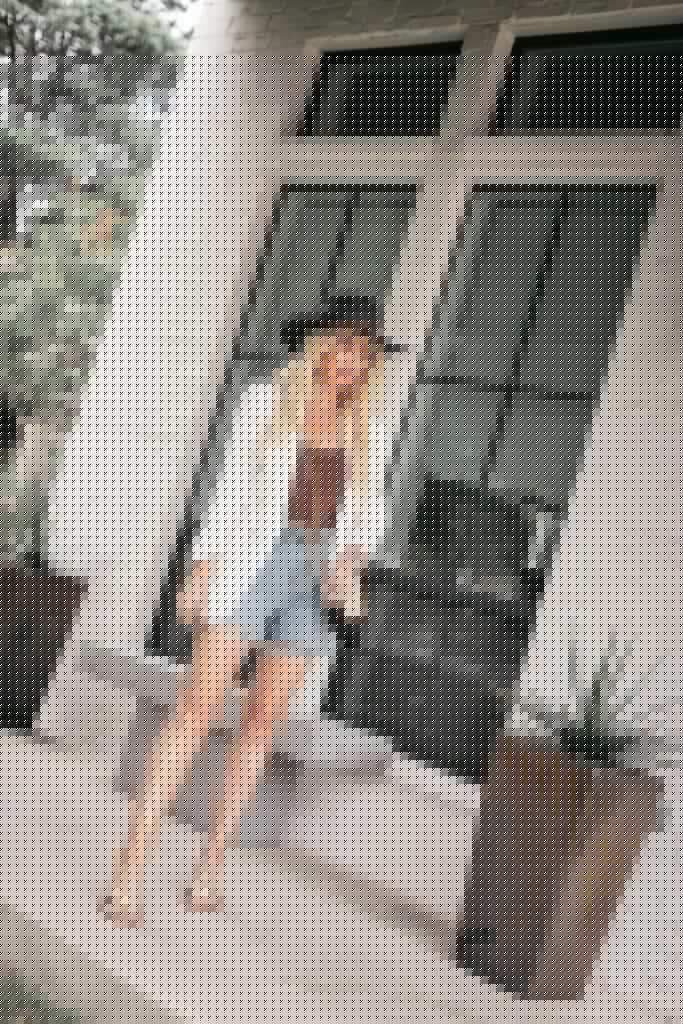 Dallas blogger wearing a white blazer and a brown bodysuit