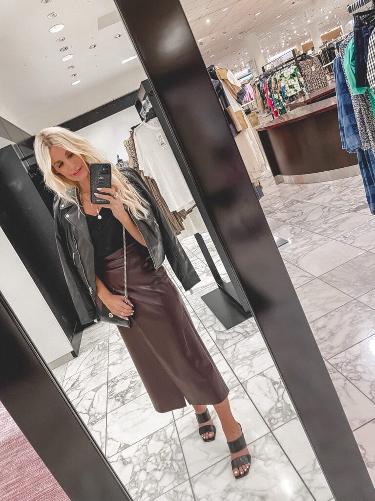 Dallas fashion blogger wearing a maroon leather skirt and a black real leather jacket