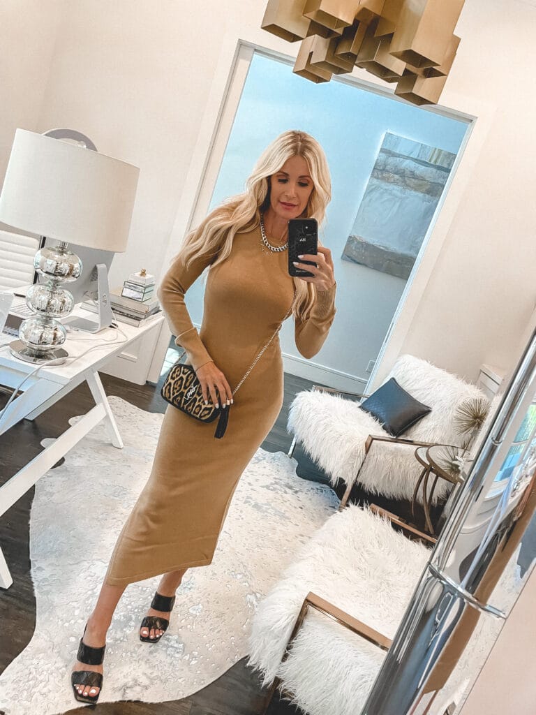 So Heather blog wearing a camel colored ribbed sweater dress