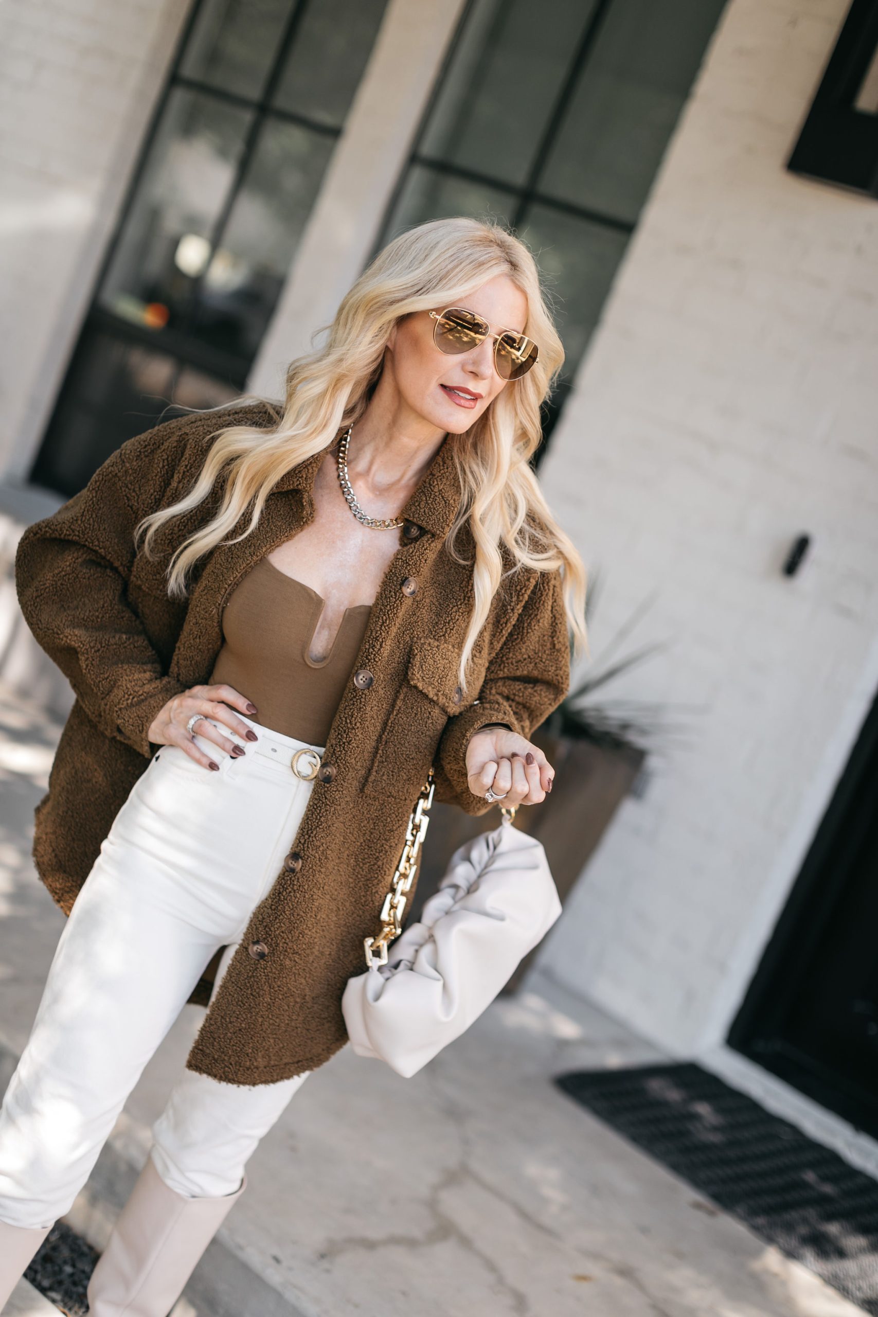 Dallas blogger wearing a sherpa shirt jacket and white denim
