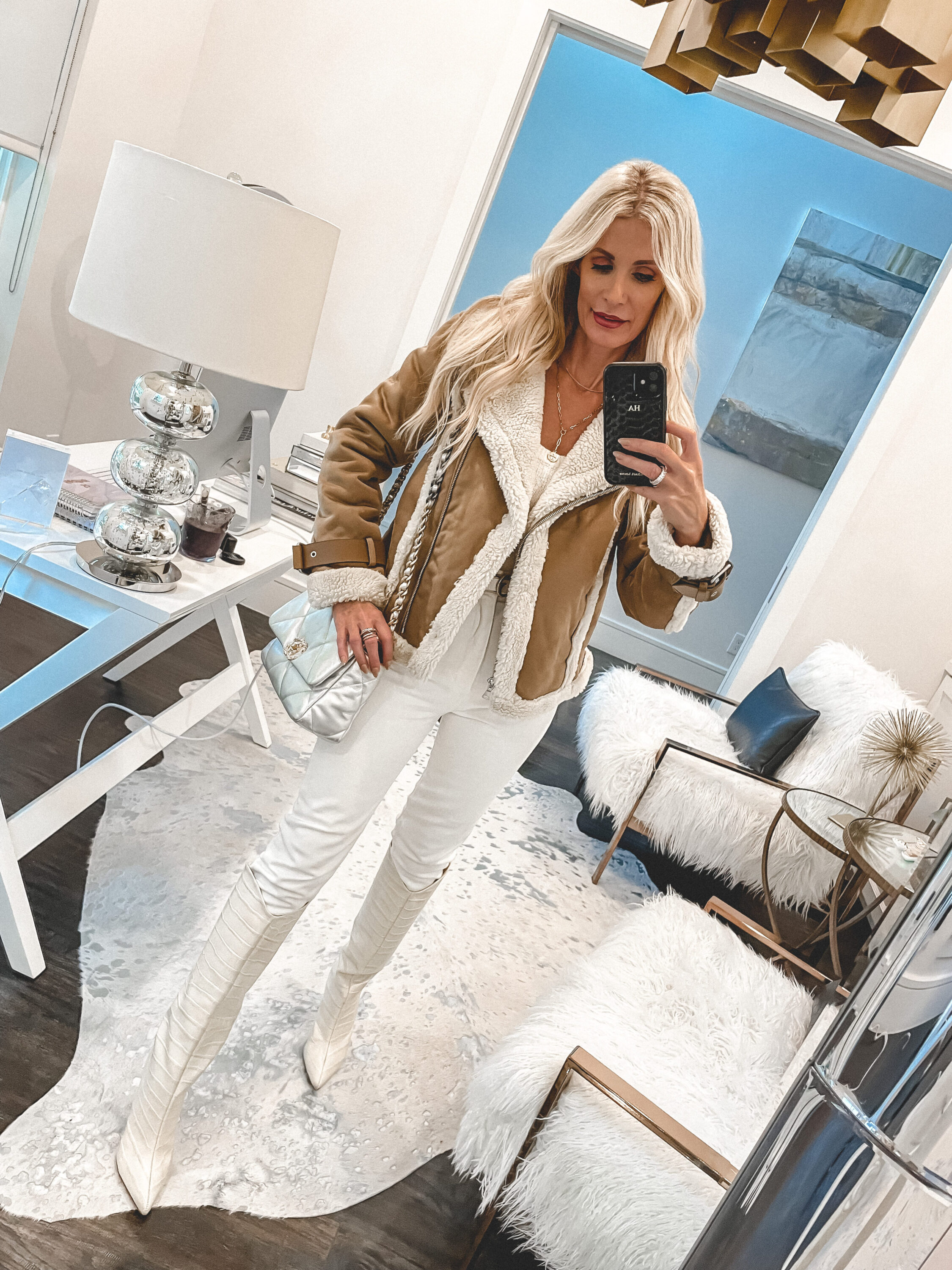 Dallas fashion blogger wearing a faux fur jacket and white denim