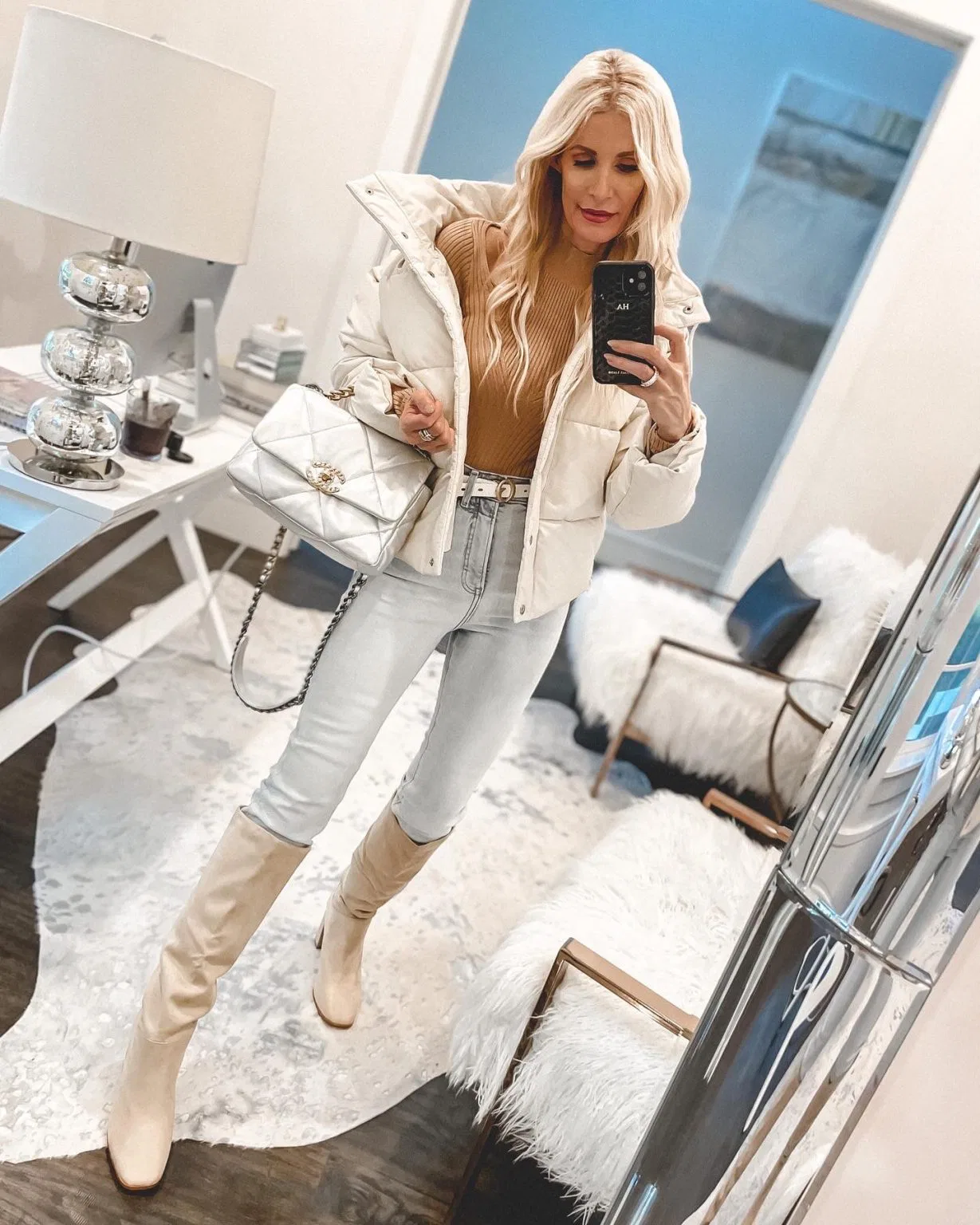 Dallas woman wearing faux leather ivory puffer jacket