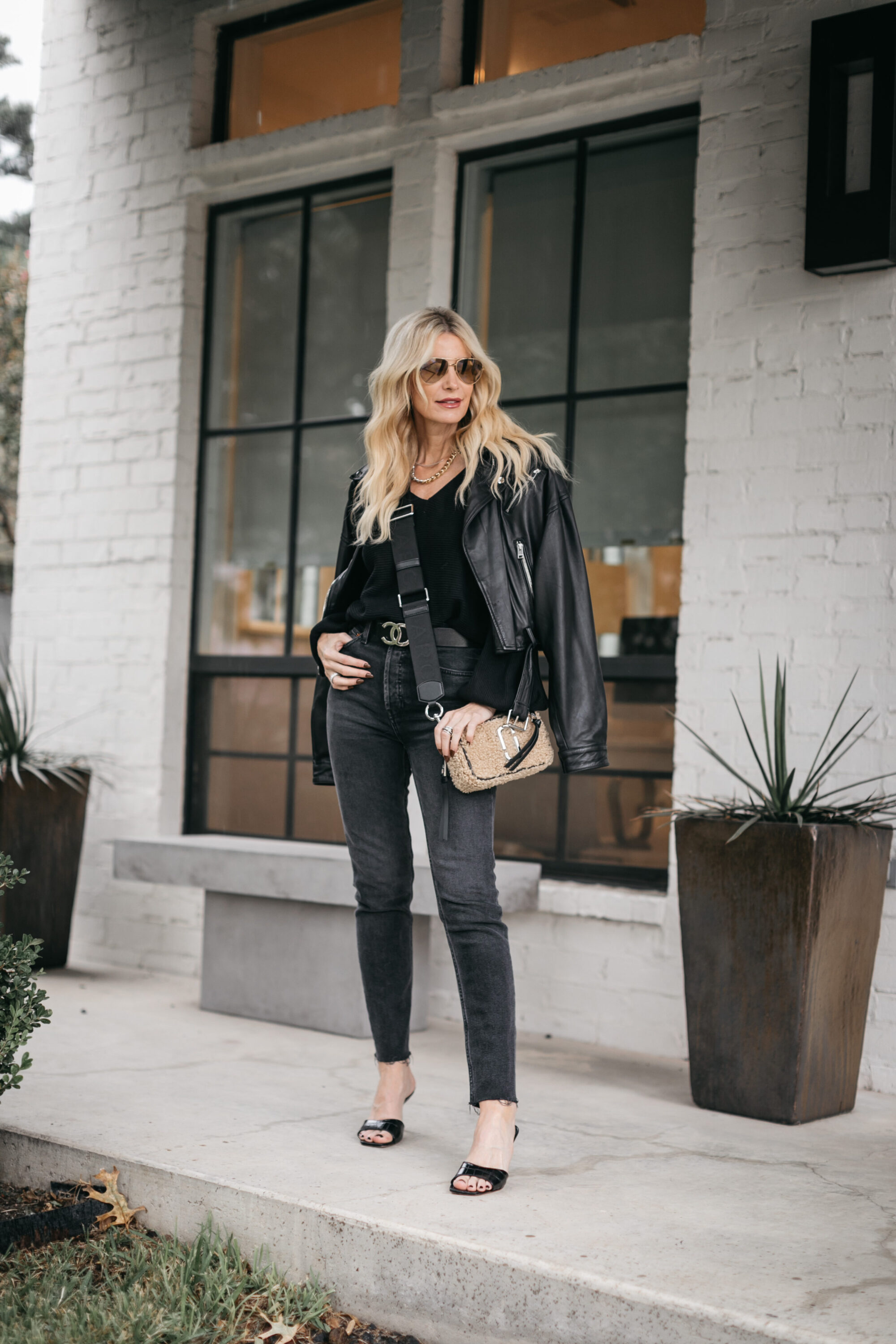 So Heather Blog wearing a black leather jacket and black denim