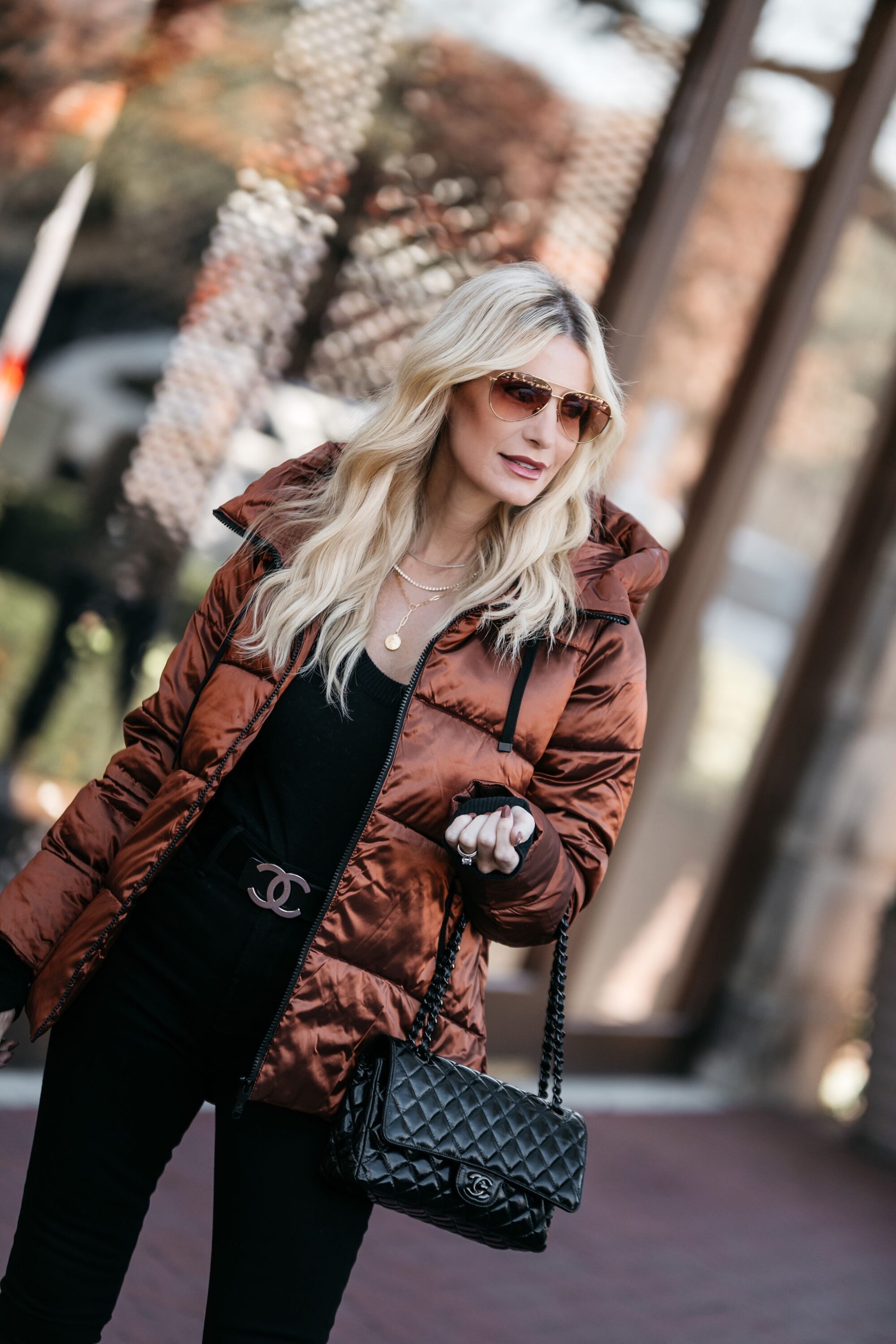 Dallas Woman over 40 wearing metallic puffer jacket