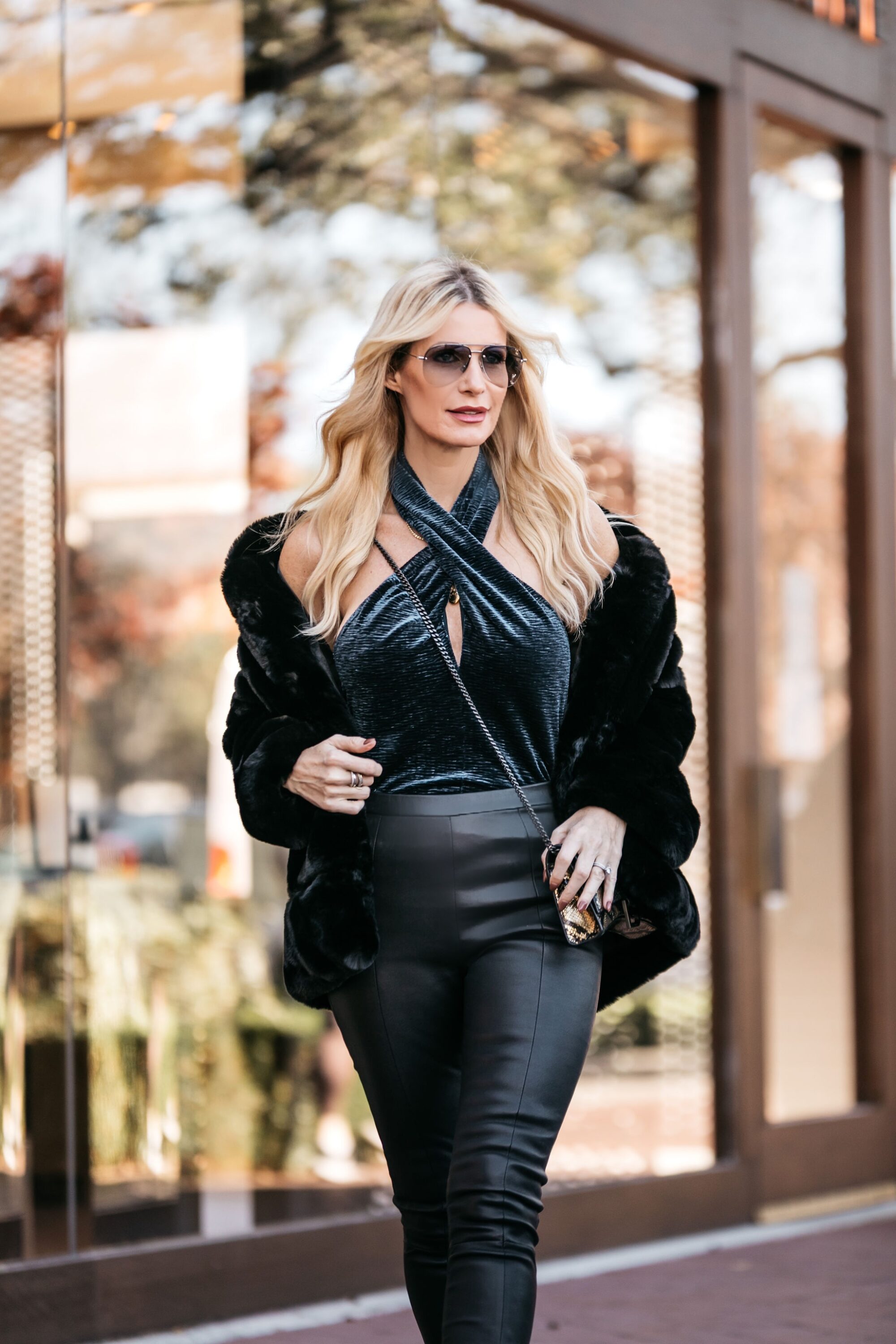 Dallas blogger wearing leather pants and a faux fur jacket