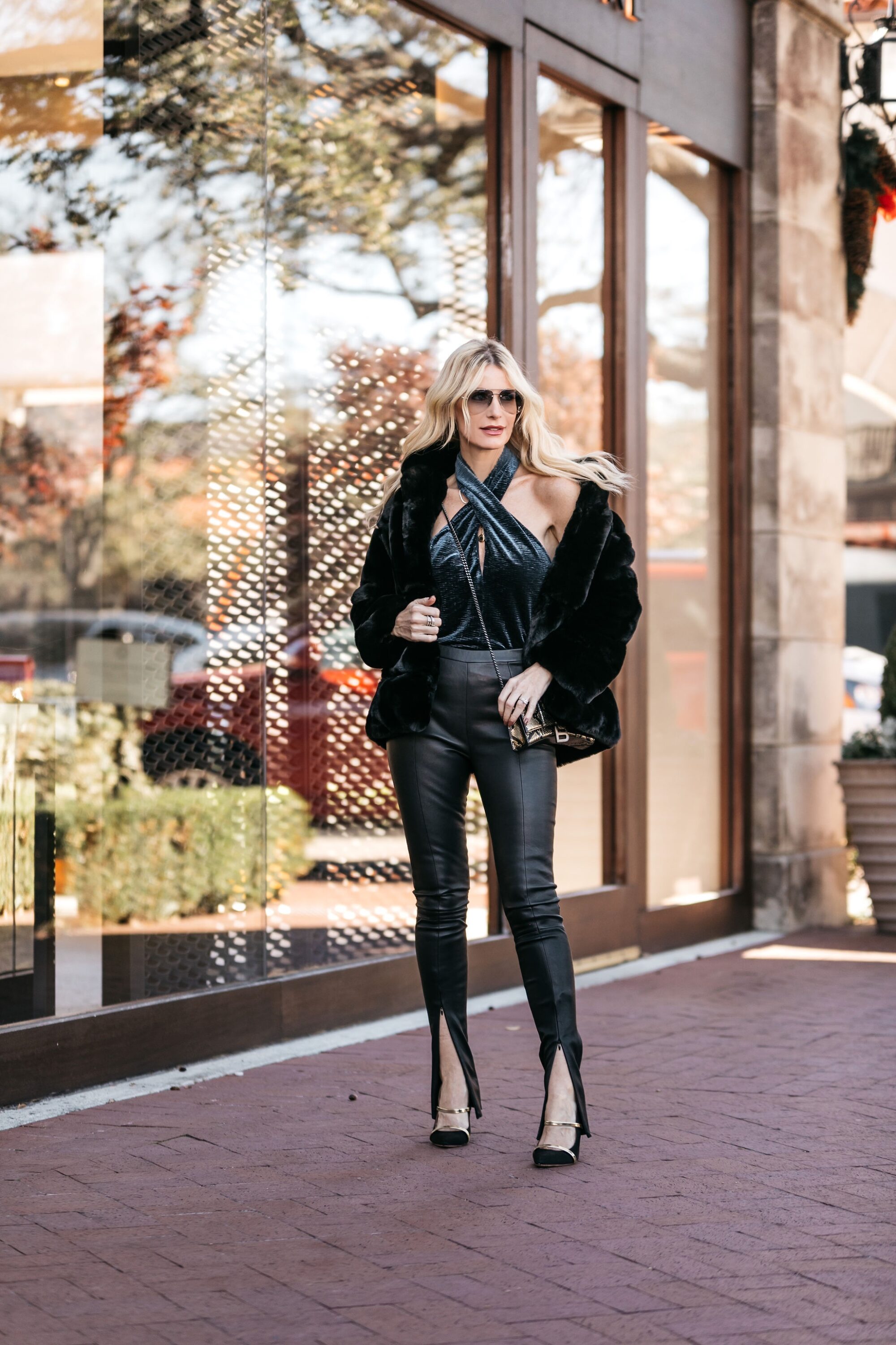 Dallas blogger wearing leather pants and a faux fur jacket
