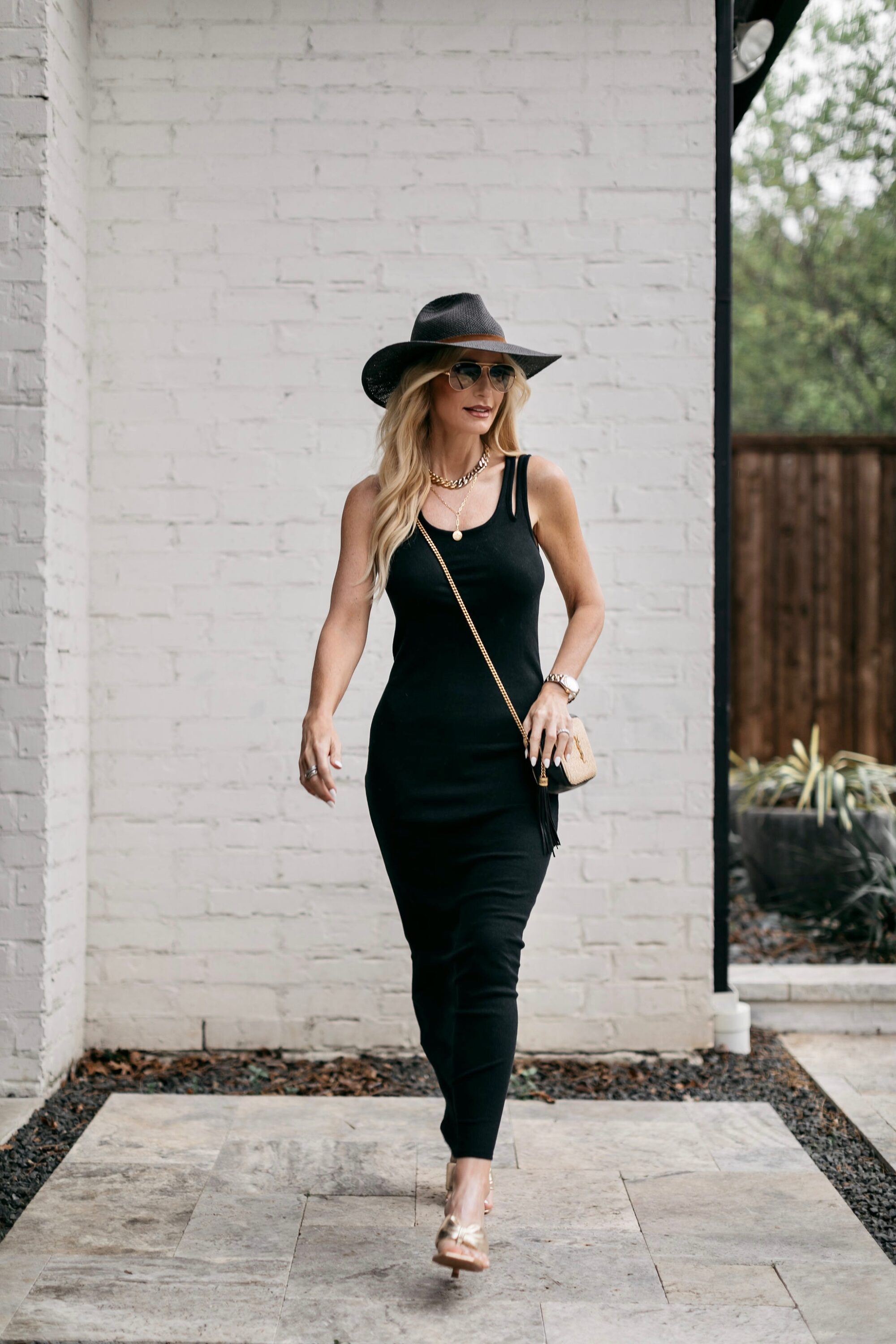 Over 40 fashion blogger wearing gold sandals, seagrass fedora, under $100 summer dresses