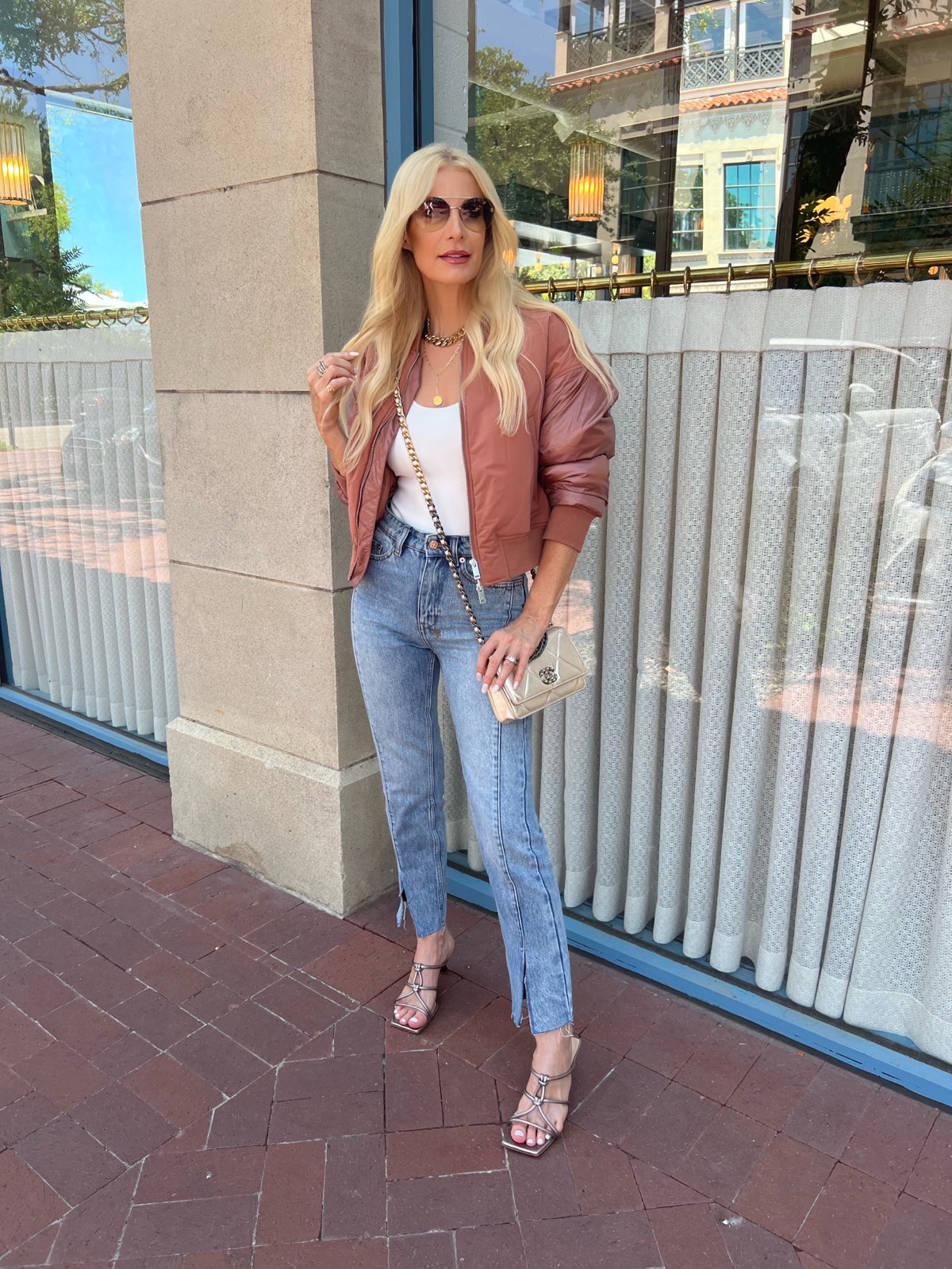 DAllas woman over 40 wearing red bomber jacket as one of the best items still in stock part of the Nordstrom Anniversary Sale
