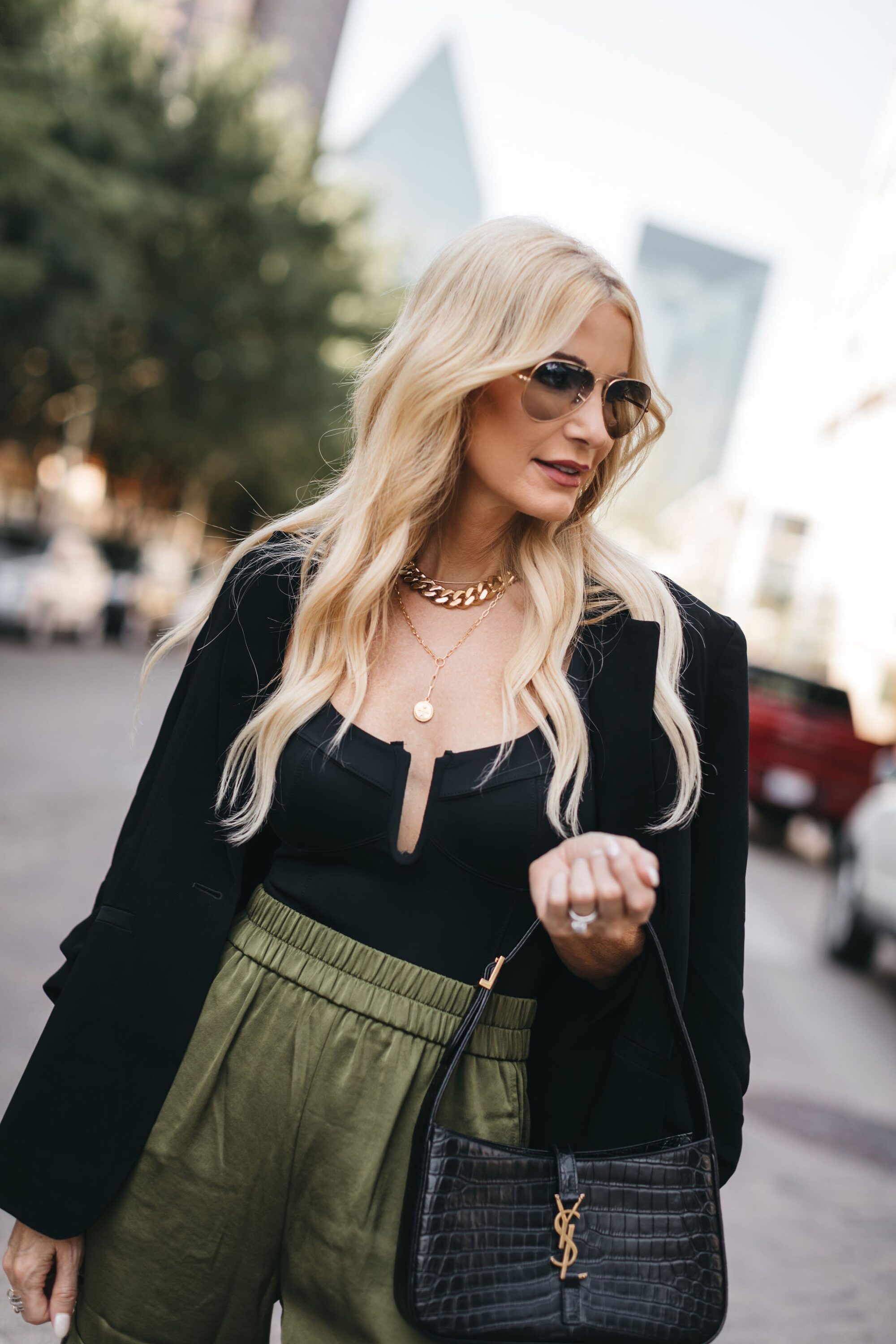 Dallas woman over 40 wearing black blazer and scuba corset bodysuit for fall 2022