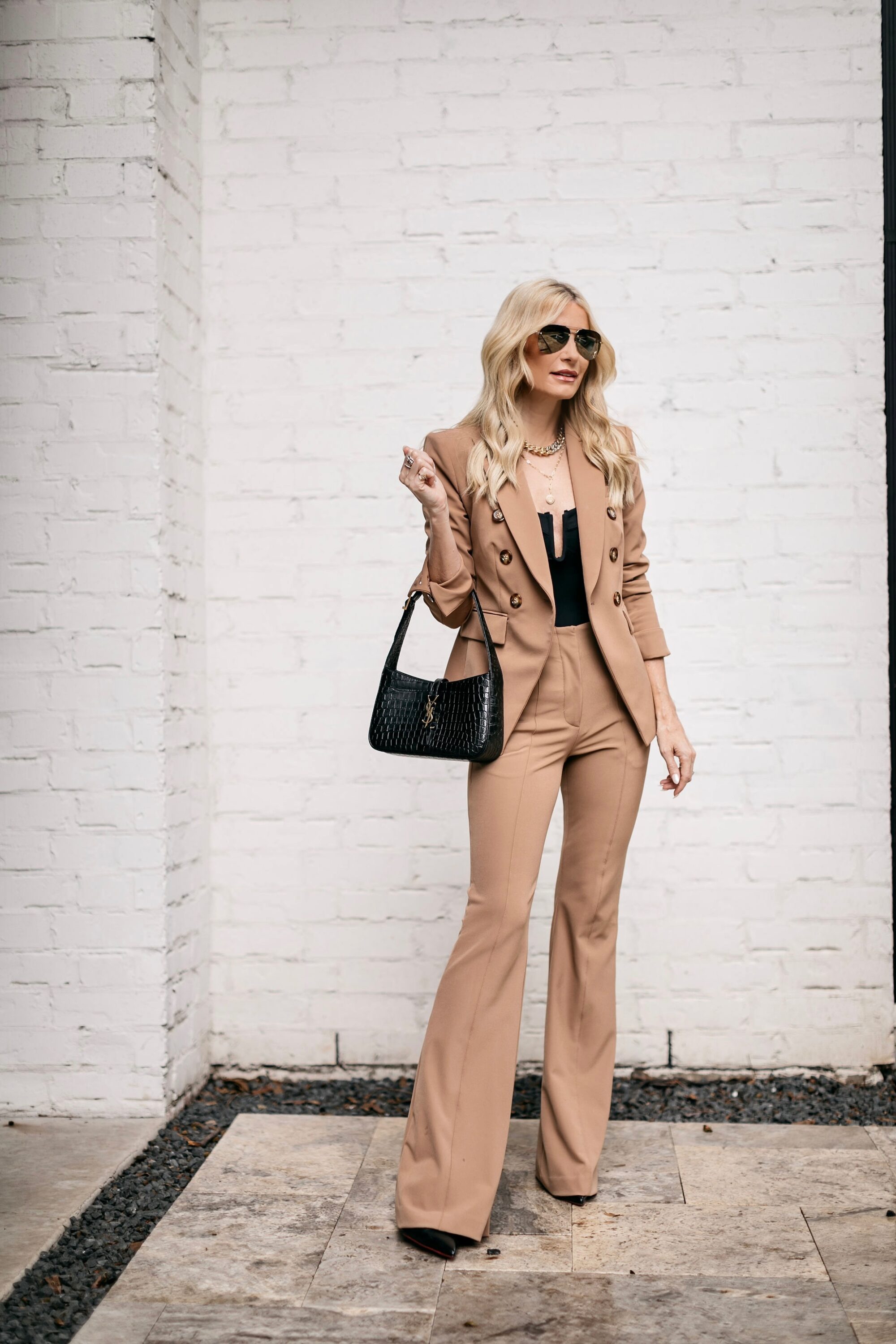 Woman over 40 wearing camel blazer as one of the best all jackets of 2022