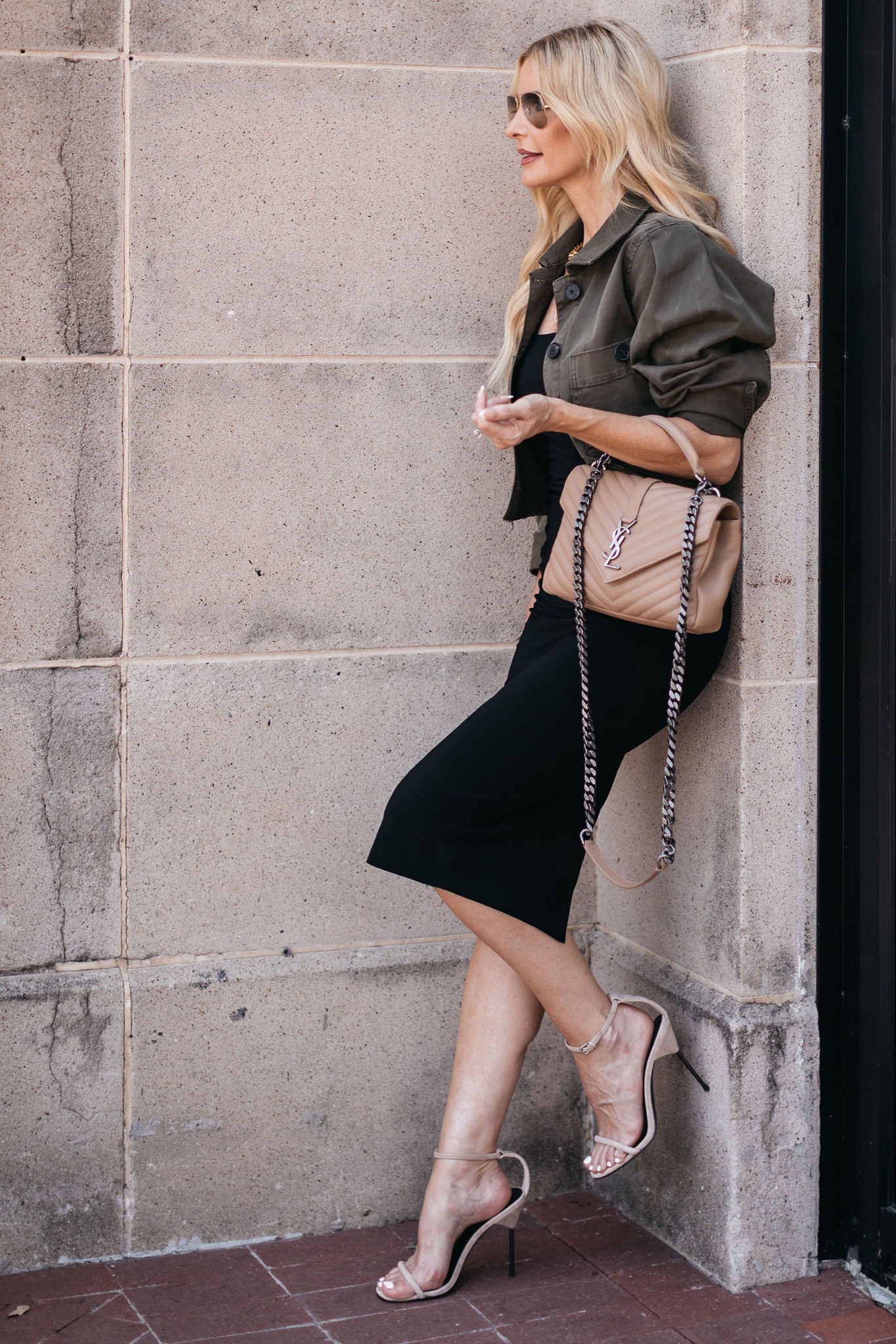 Dallas fashion blogger styling little black dress with olive utility jacket