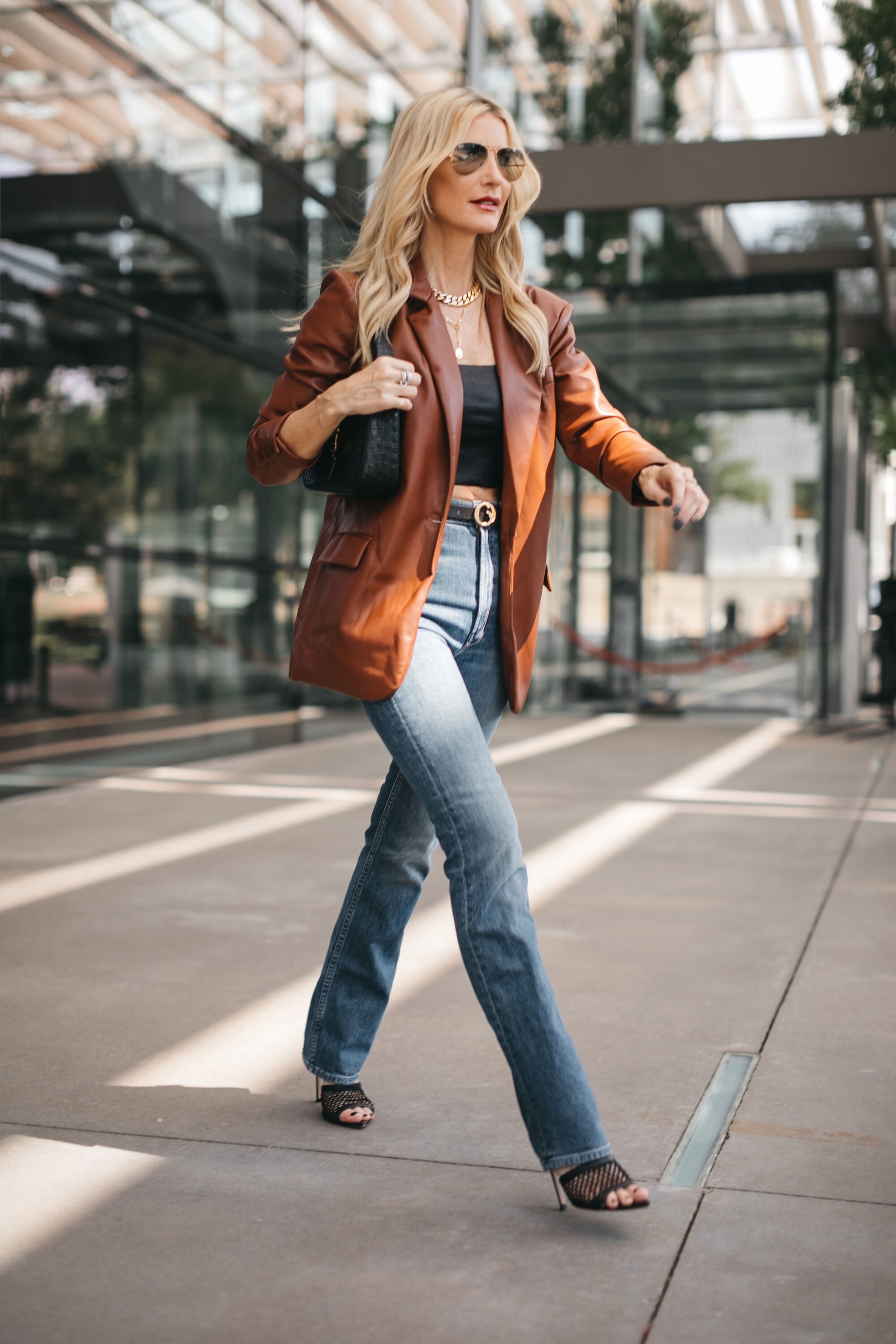 Dallas fashion blogger wearing straight leg denim with no distressing as one of the top denim trends of 2023.