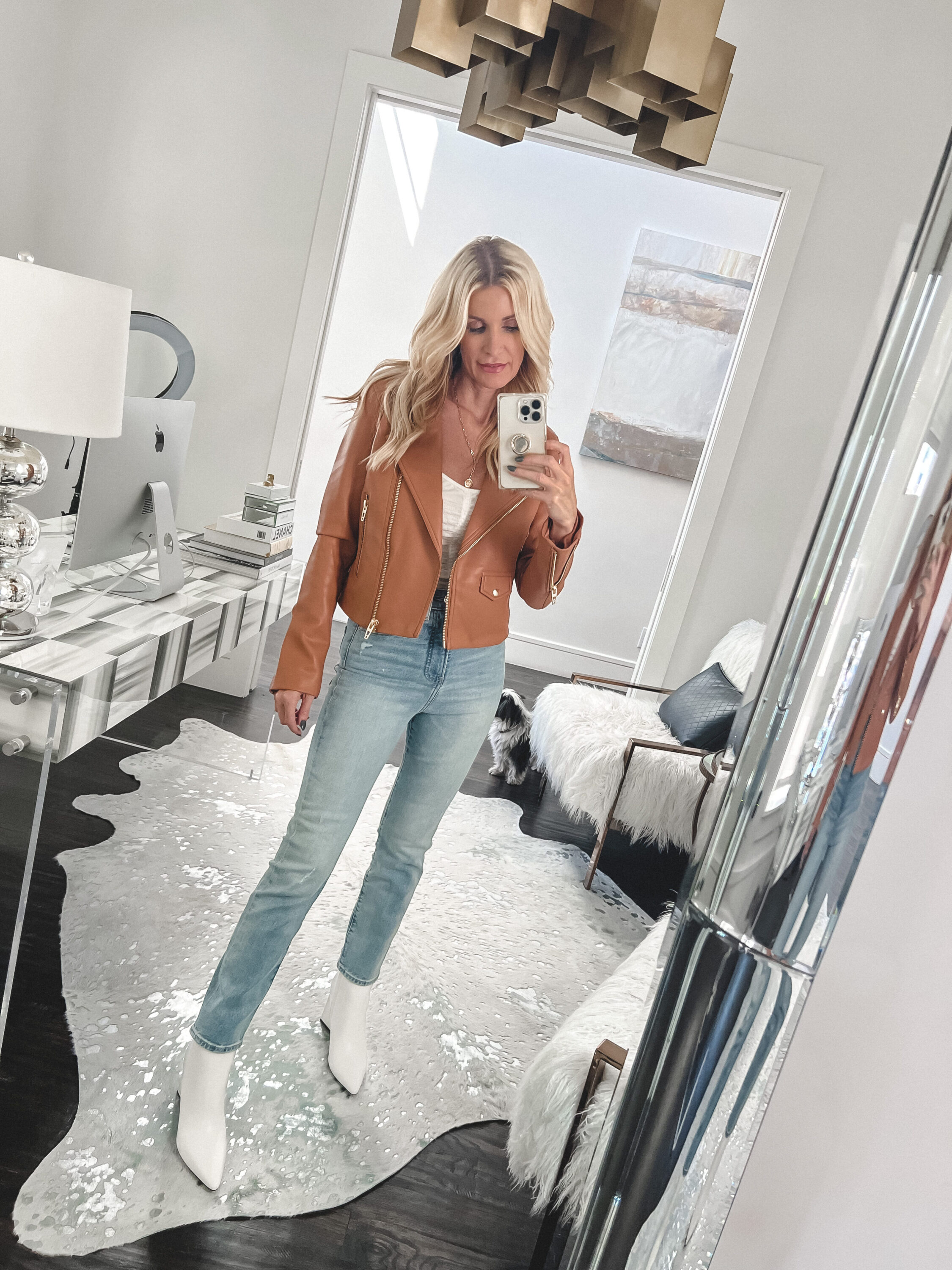 Woman over 40 wearing Express jeans and camel faux leather jacket as top under $100 FALL basics.