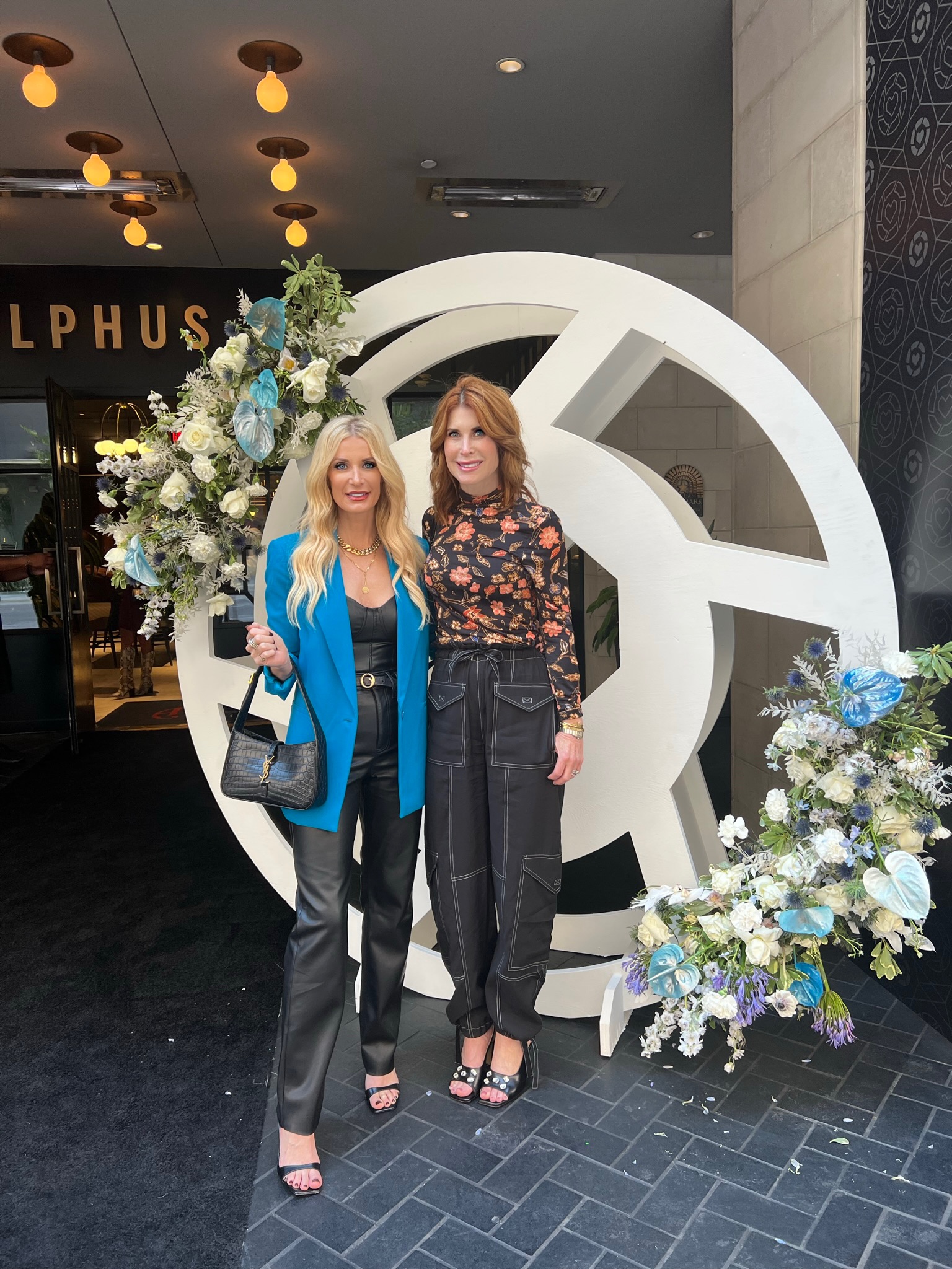 Over 40 fashion bloggers wearing Alice & Olivia blazer with faux leather pants and top.