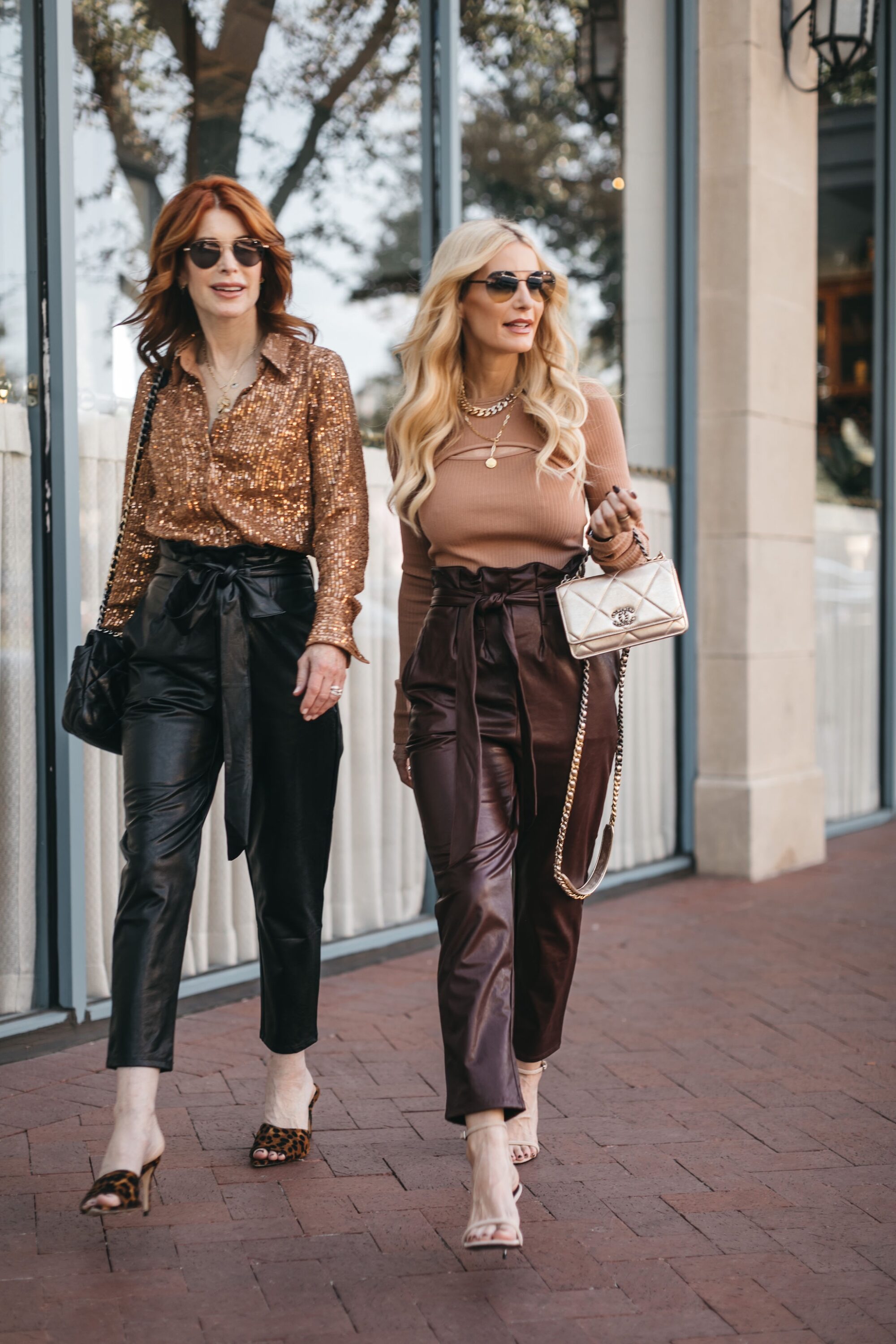 Over 40 Dallas fashion influencers wearing slimming pants with fall inspired tops and statement heels.