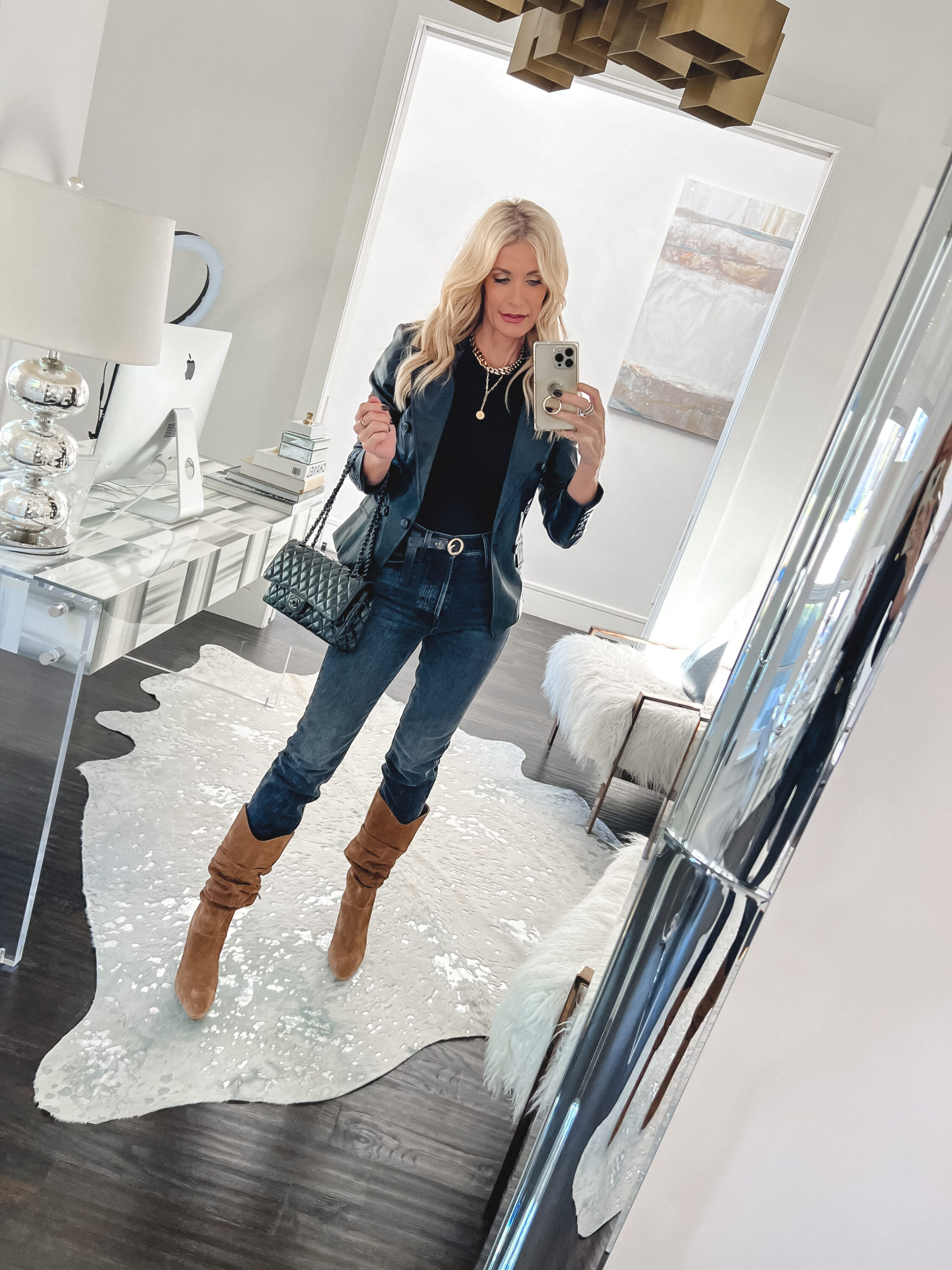 Dallas fashion blogger over 40 wearing faux leather blazer and mother jeans.