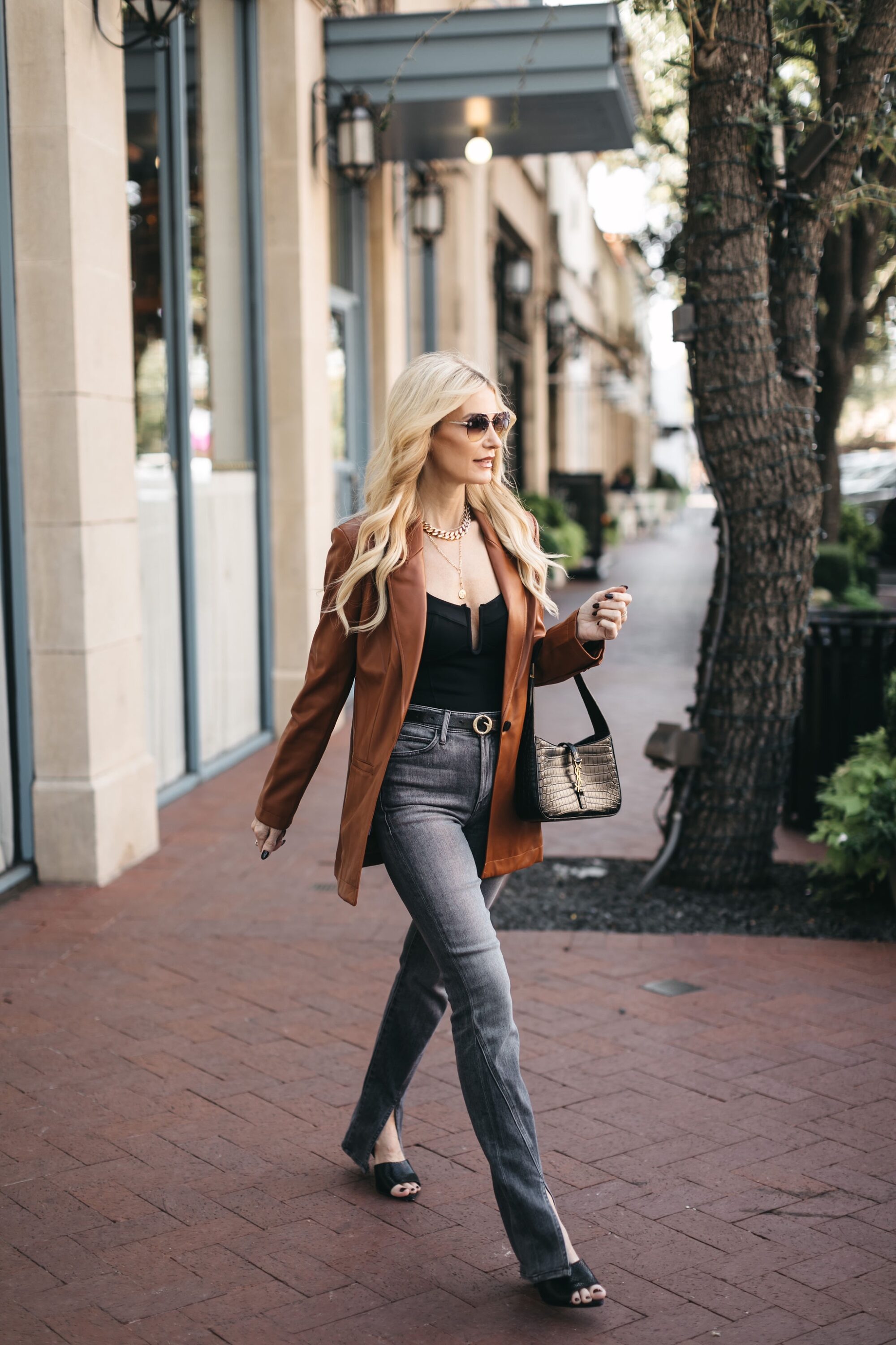 Over 40 fashion influencer wearing gray mother jeans as one of the best selling items in November 2022.