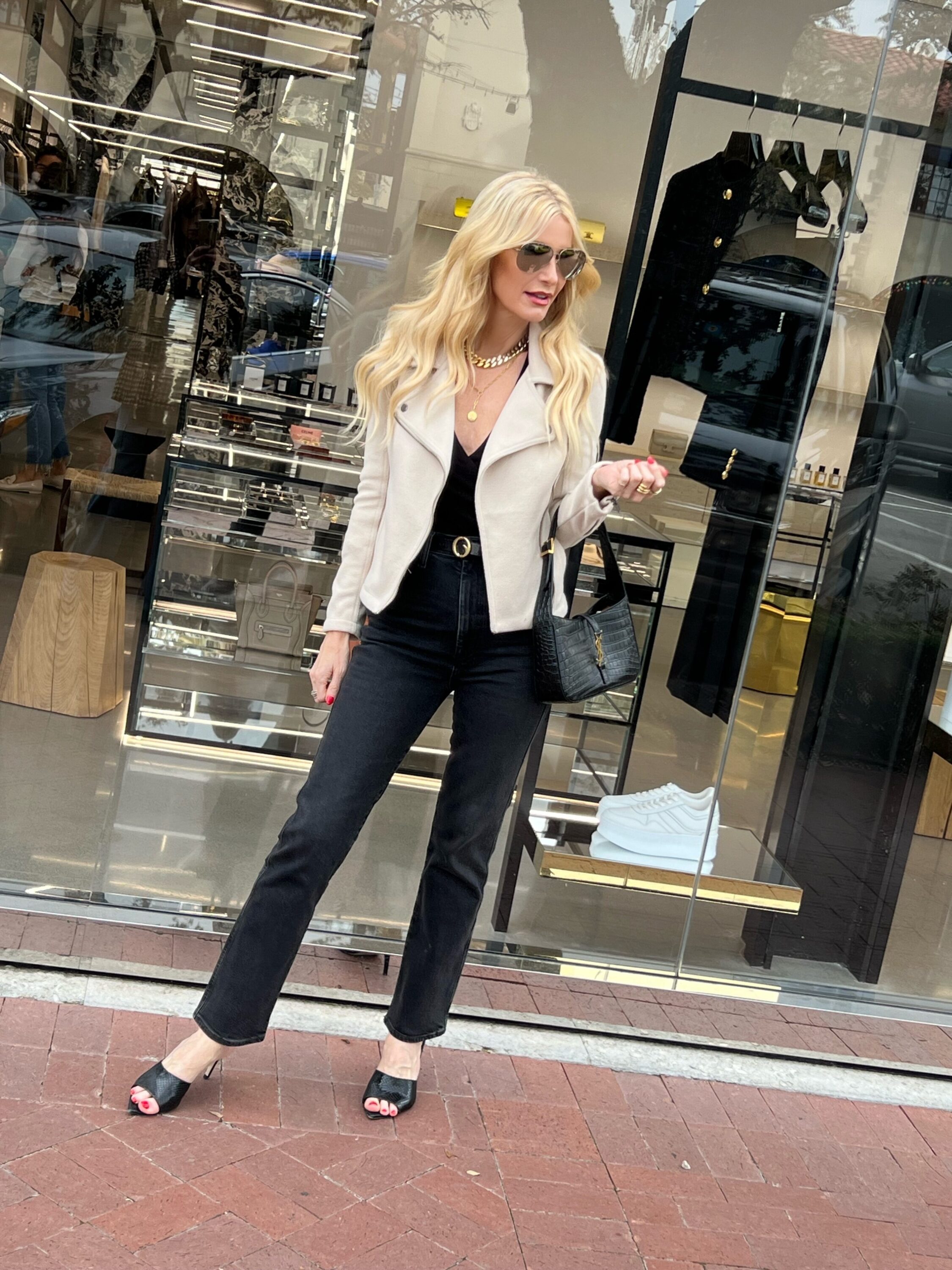 Over 40 fashion blogger wearing soft ivory moto jacket as one of January's top sellers.