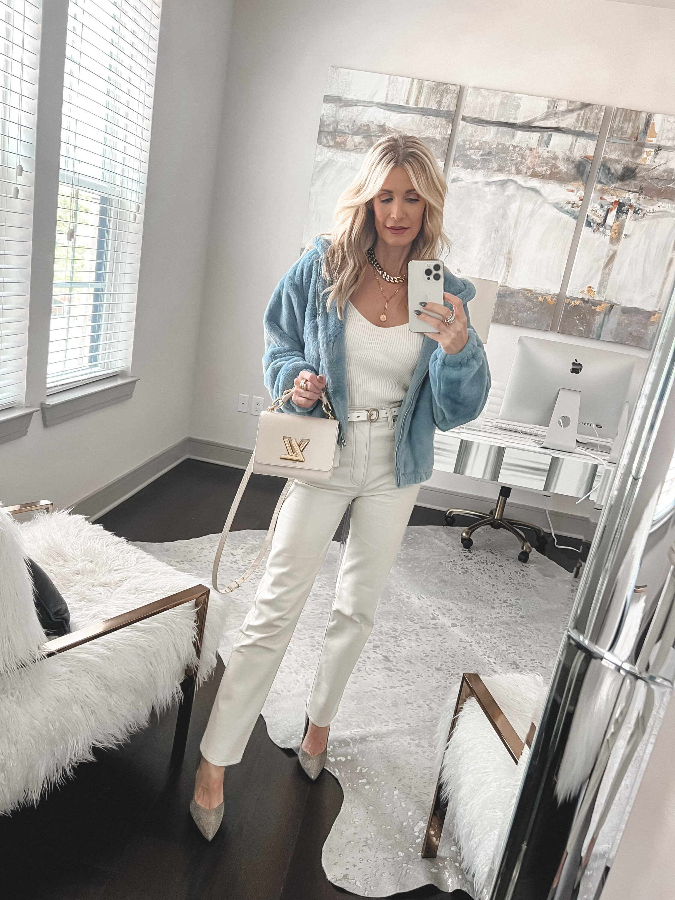 Over 40 fashion influencer wearing light blue faux fur jackets as one of 5 favorites faux fur jackets.