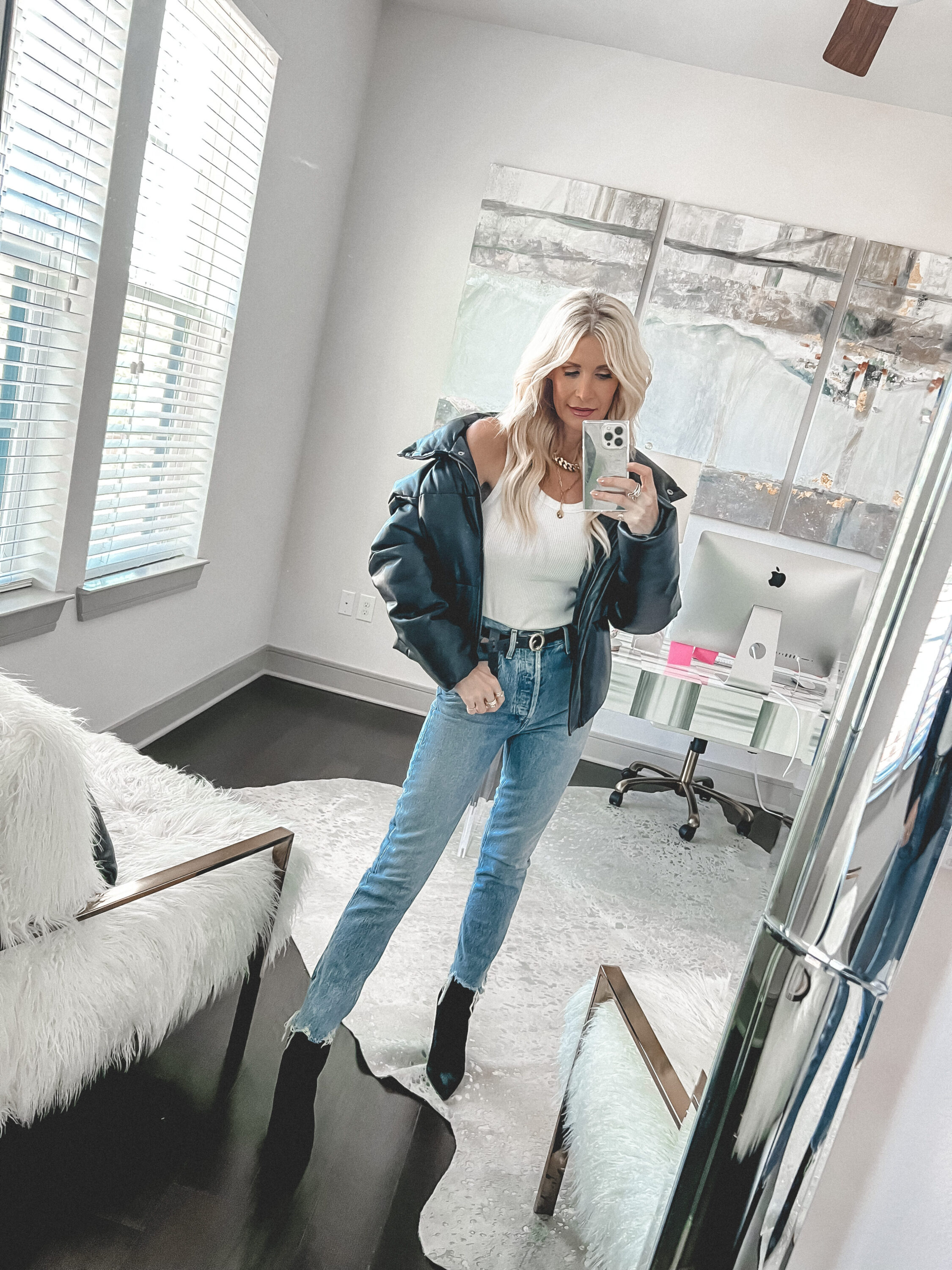 Over 40 fashion influencer wearing agolde riley jeans and Veronica Beard booties as 2 of the best selling items in 2022.