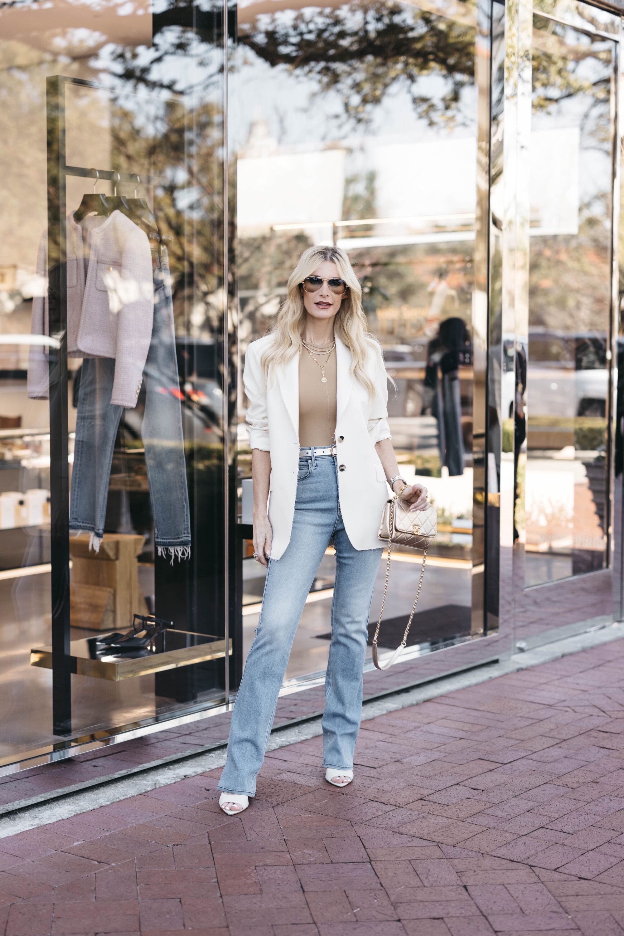 Over 40 fashion blogger wearing an oversixed blazer with light was baby flare jeans as one of 5 easy outfit formulas.