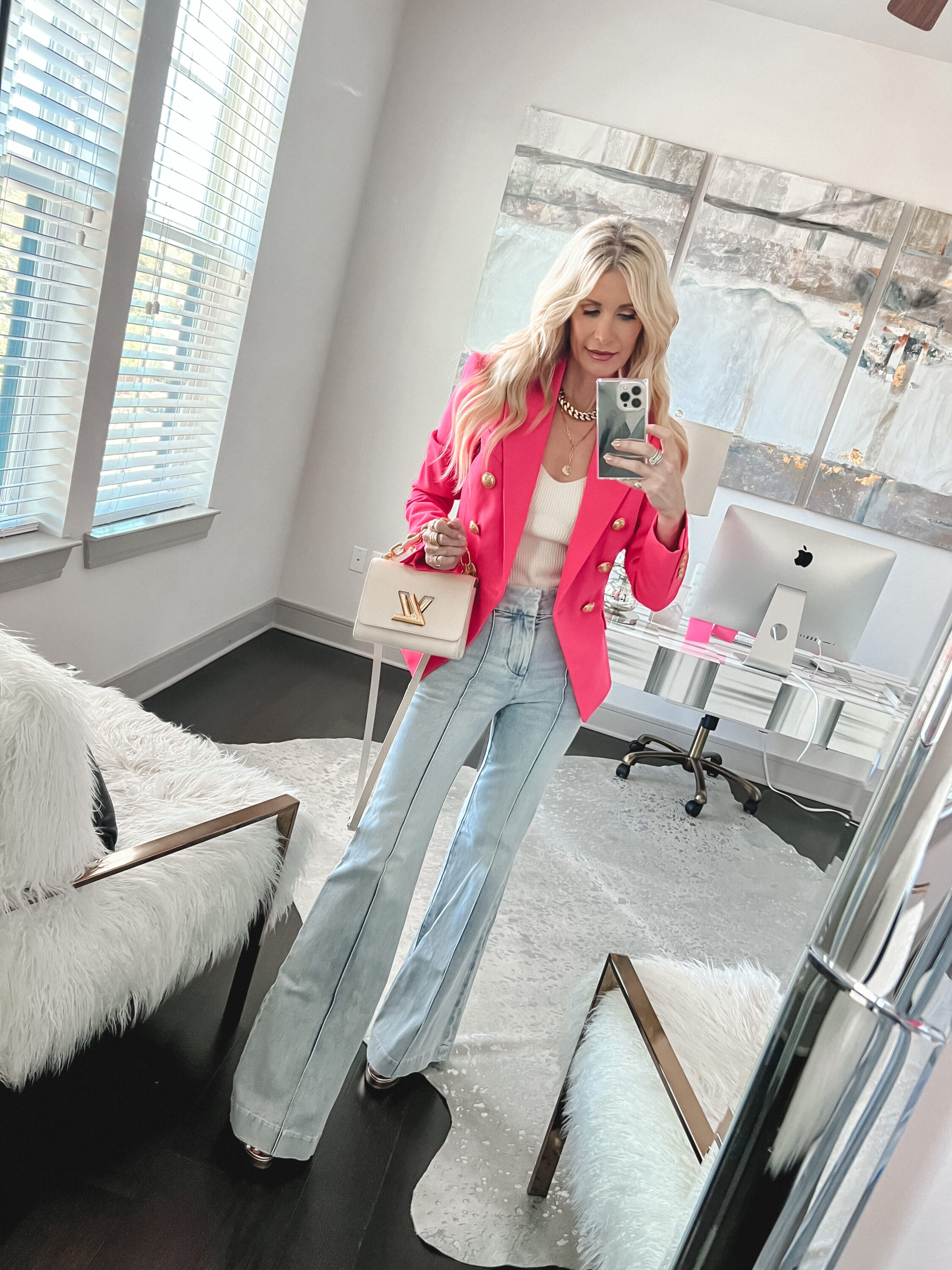 Over 40 fashion influencer wearing the infamous Balmain blazer as one of January's top sellers.