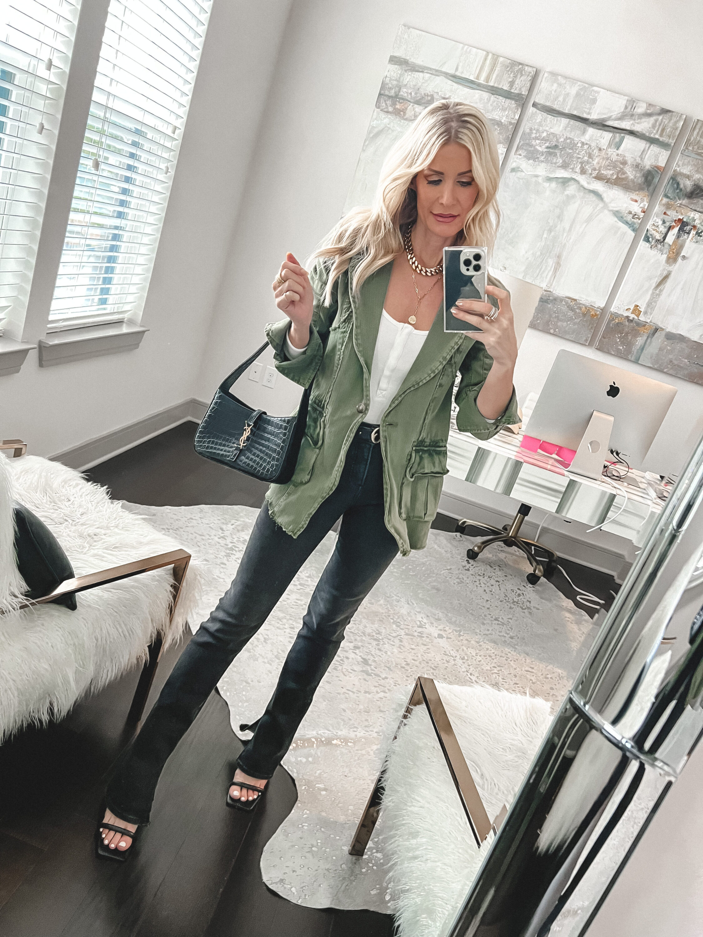 Over 40 fashion blogger wearing strappy heels as one of the hottest shoe trends of 2023.