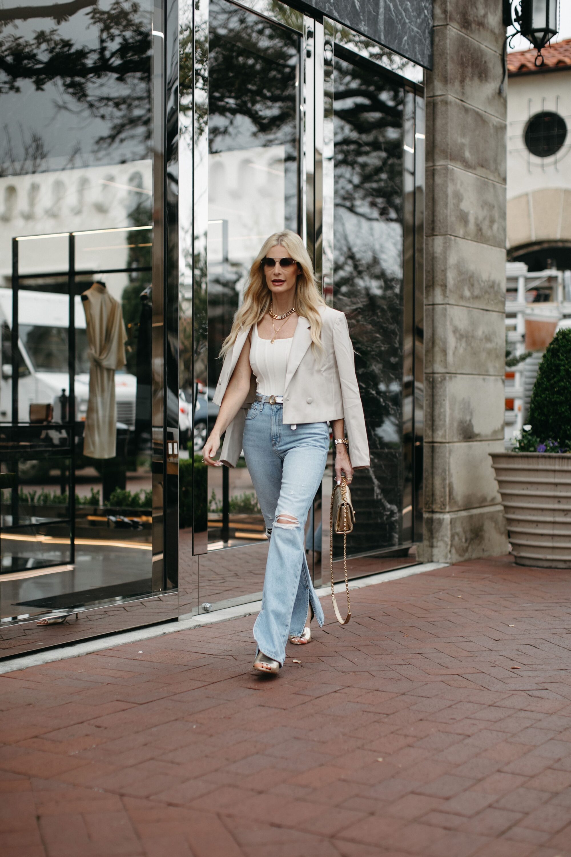 Dallas fashion influencer for over 40 wearing ivory leather jacket as one of the best spring jackets of 2023.