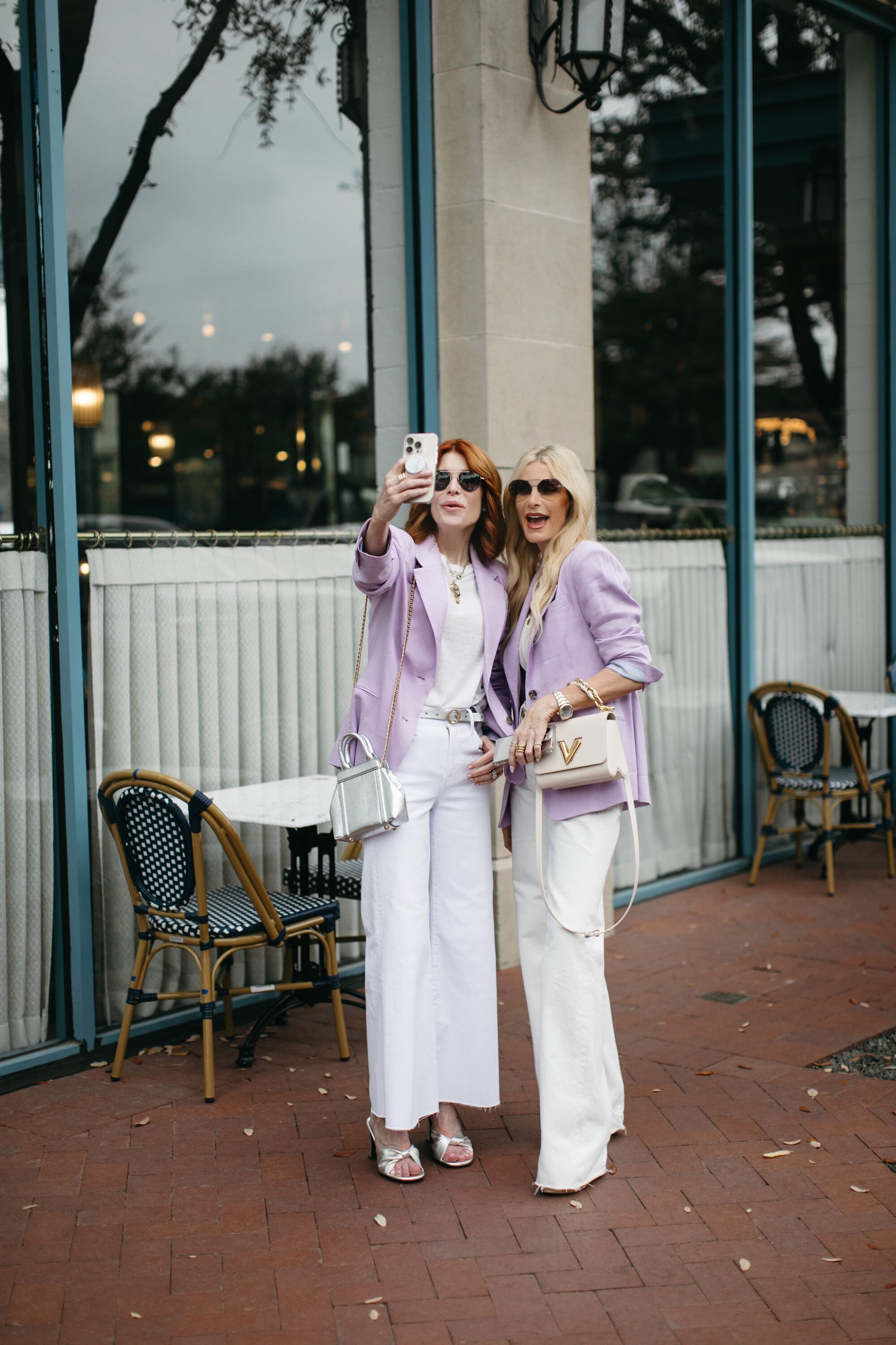 Dallas fashion influencers for women over 40 taking a selfie together.