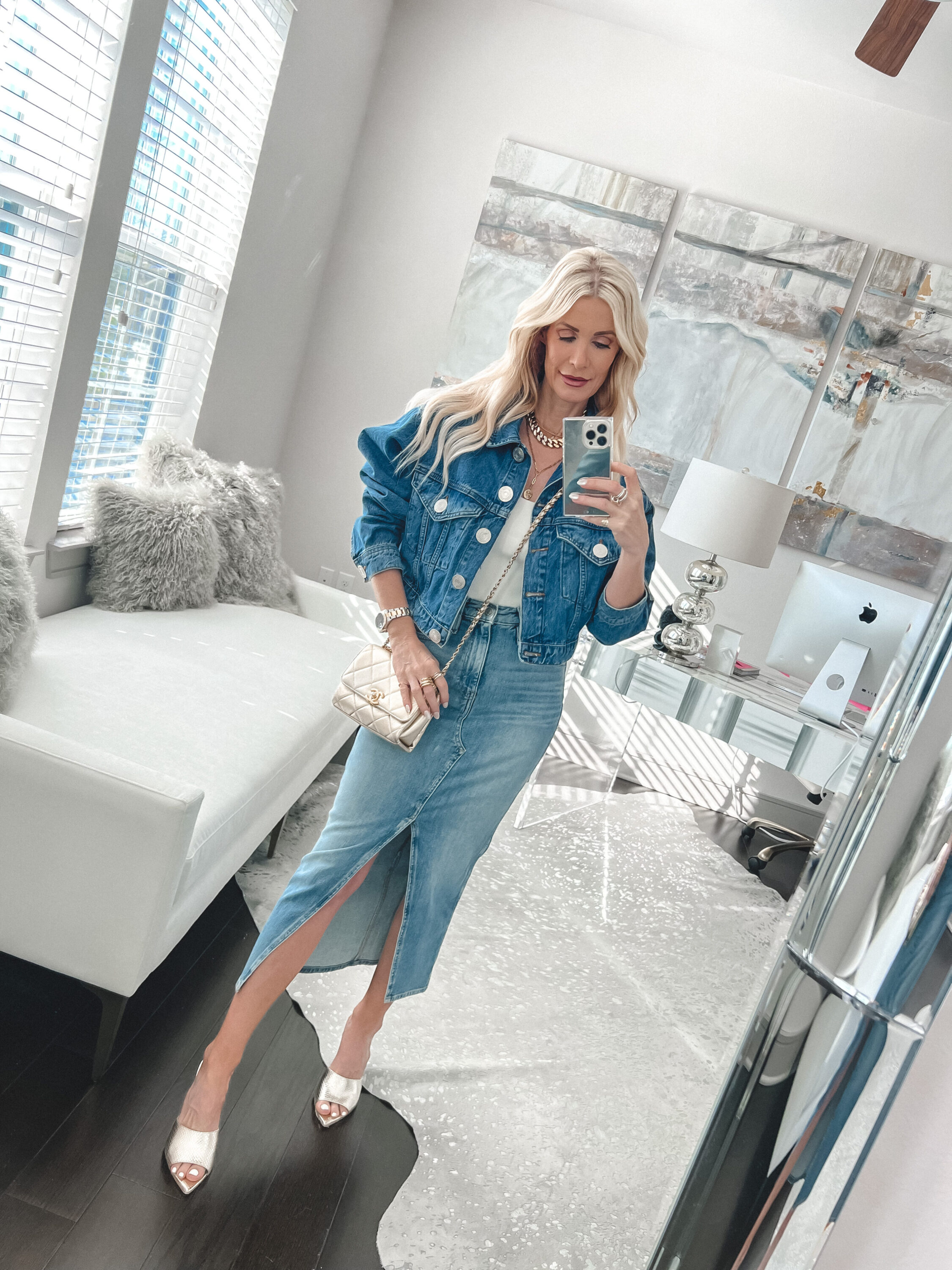 Dalls over 40 influencer wearing denim midi skirt with denim jacket as a trending way how to style a denim jacket.
