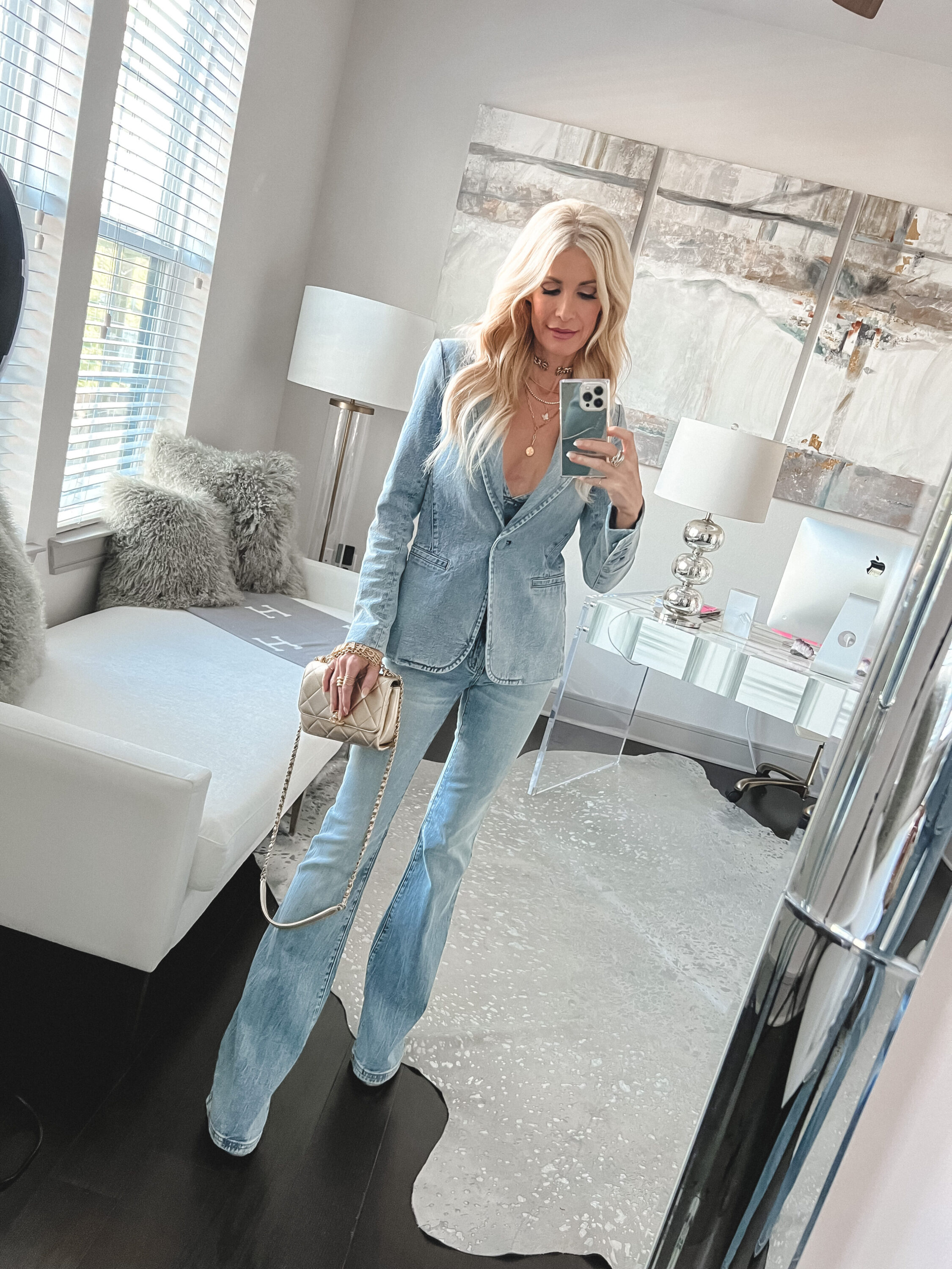 Over 40 Dallas fashion blogger wears a a denim blazer with bell bottom jeans from Alice & Olivia as the final option for how to style a denim jacket.