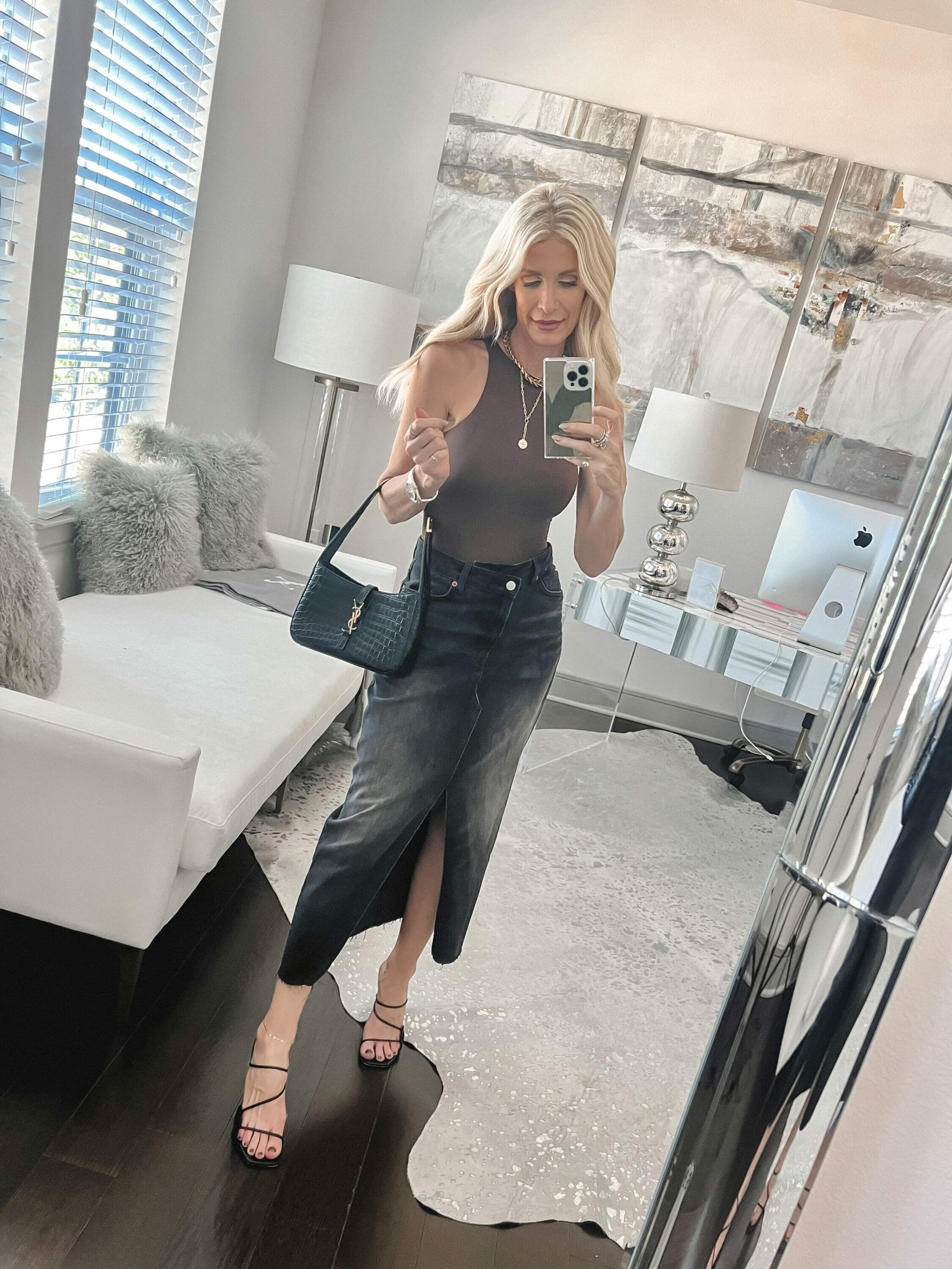 Dallas woman over 40 wearing an alternative option for a top to wear with a denim midi skirt.