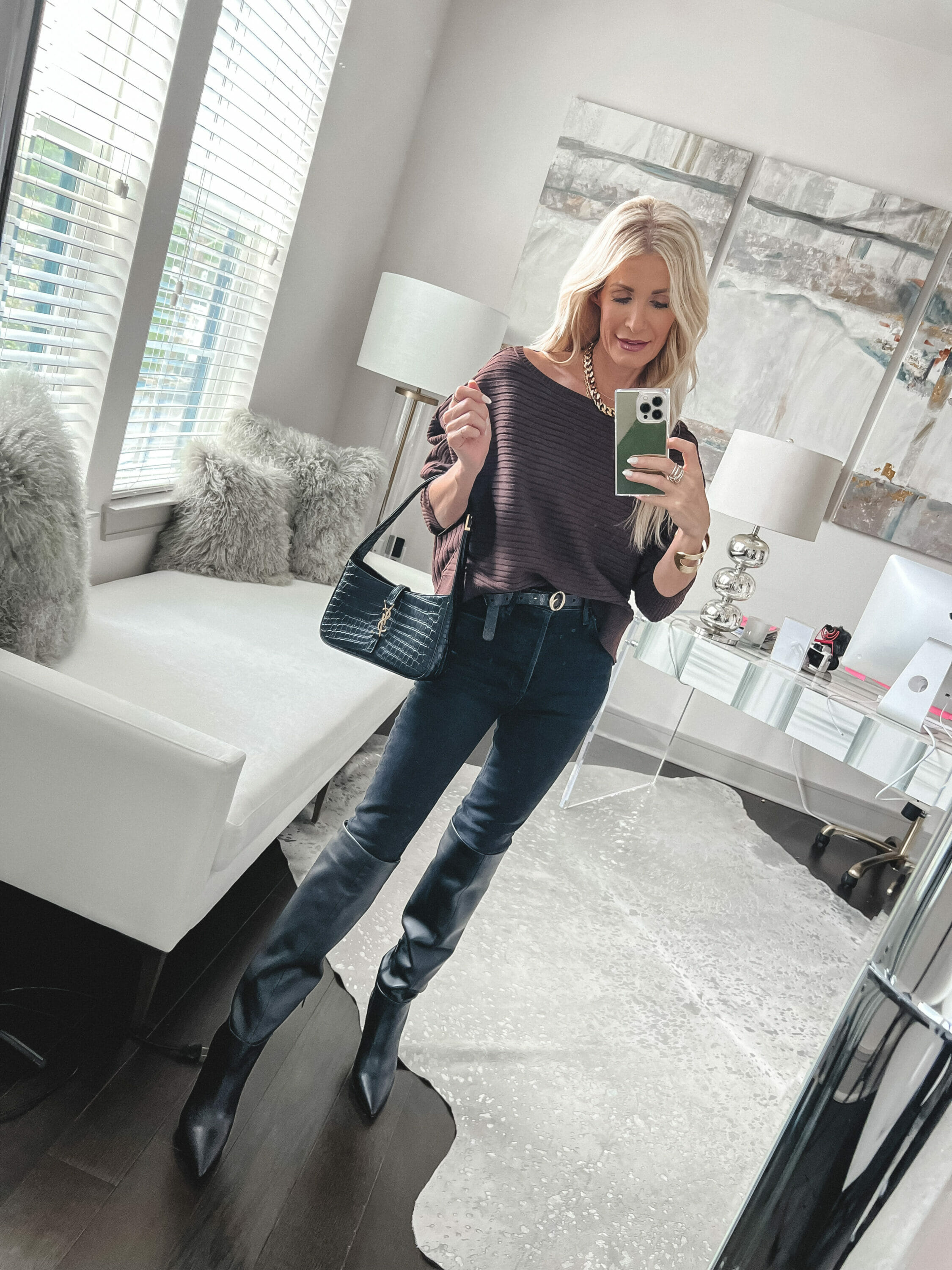 Dallas fashion blogger for women over 40 wearing a brown Free People sweater with dark wash jeans and knee high boots.