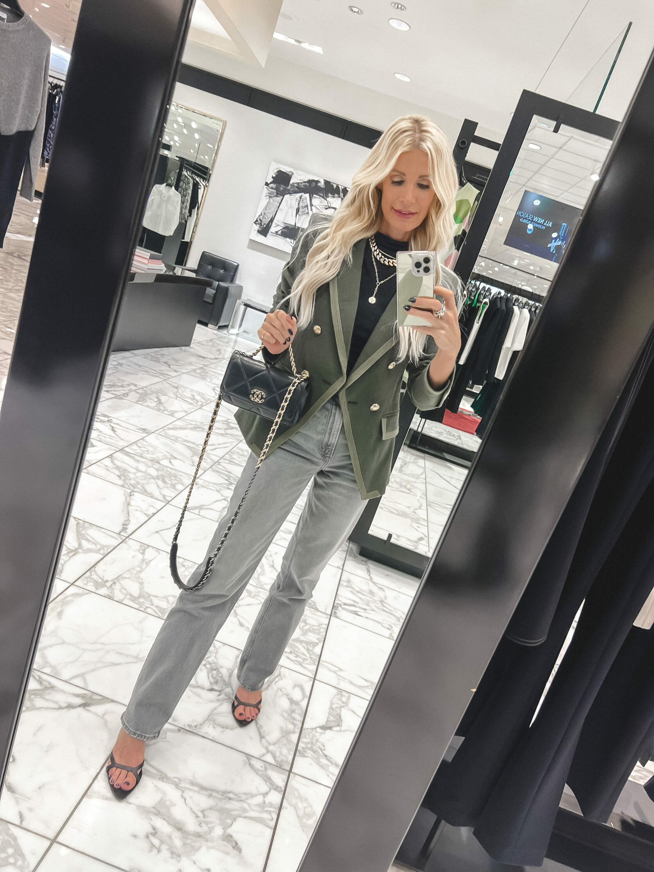 Over 40 Dallas woman wearing grey Abercrombie jeans with a classic blazer as one of 5 must-have fall jackets.