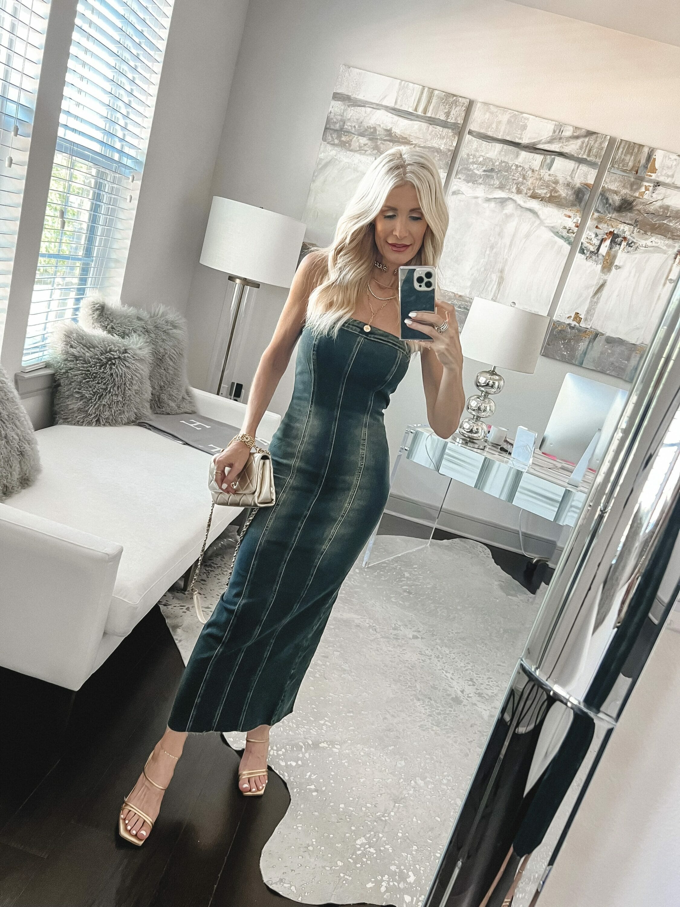 Dallas over 40 fashion influencer wearing a denim maxi dress from Alice & Olivia with gold accessories as one of 8 fall dresses for every occasion.