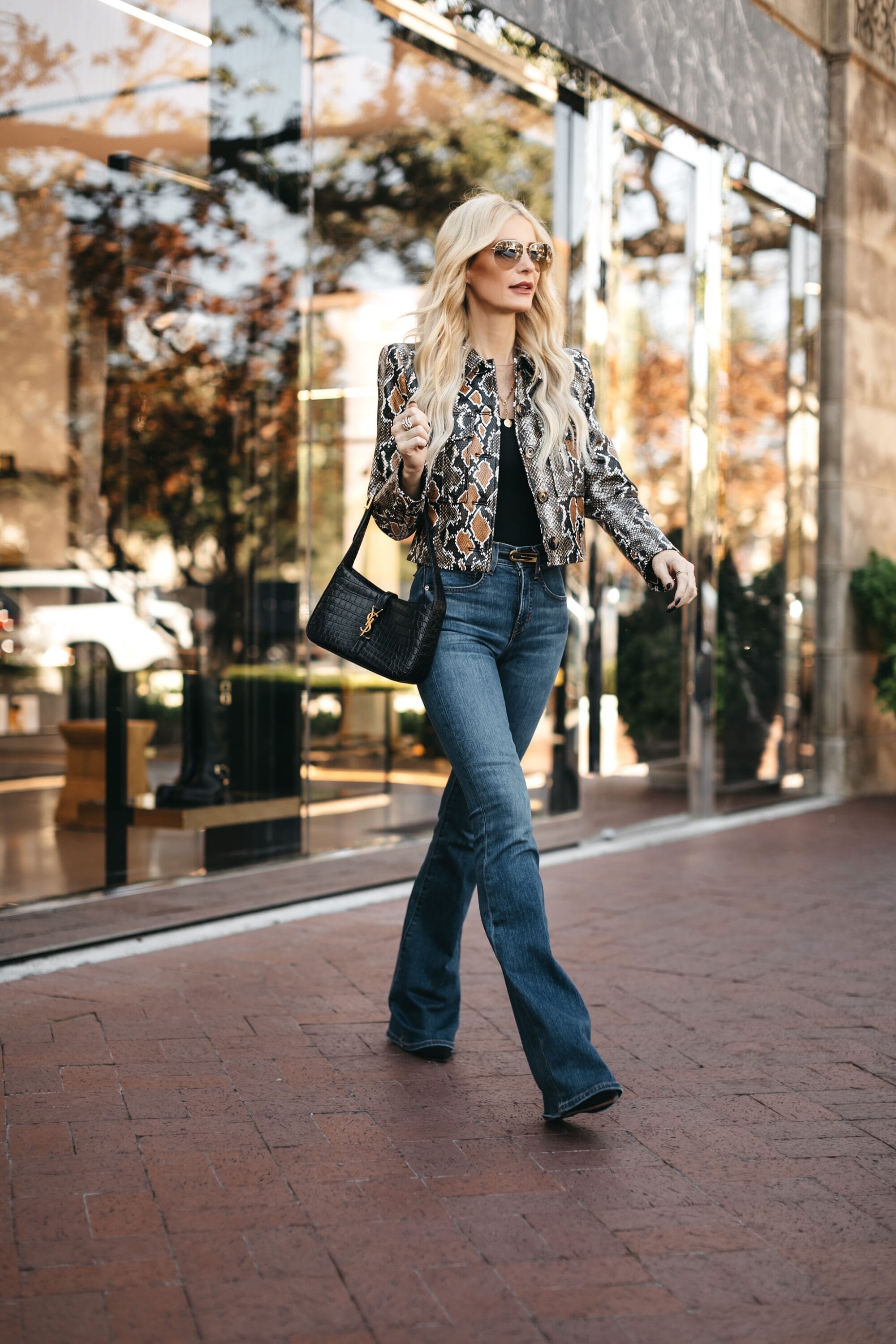 Over 40 fashion blogger showcasing the hottest denim trends of 2024 in 5 fabulous fall looks.