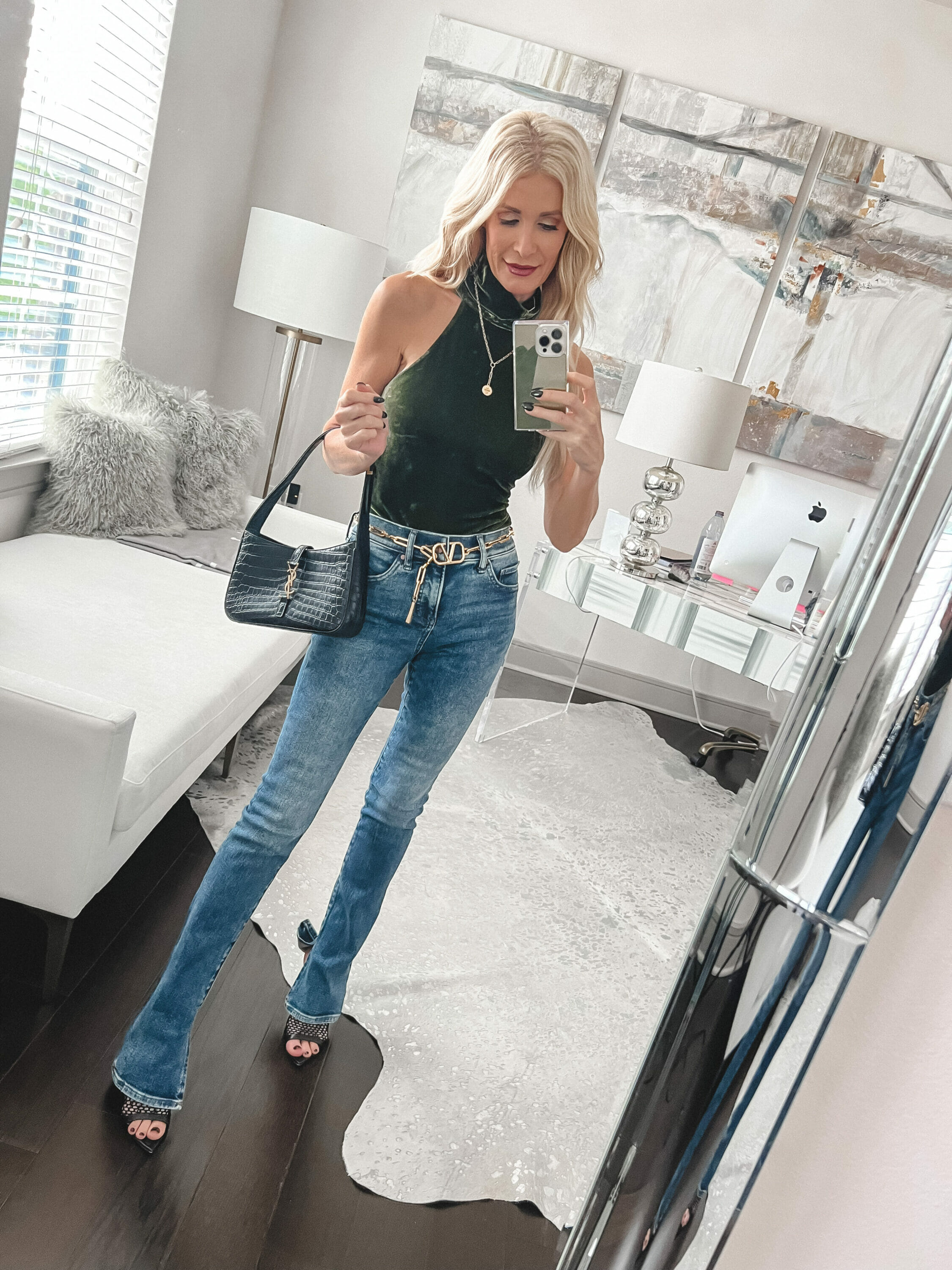 Over 40 fashion blogger wearing express jeans and velvet bodysuit.