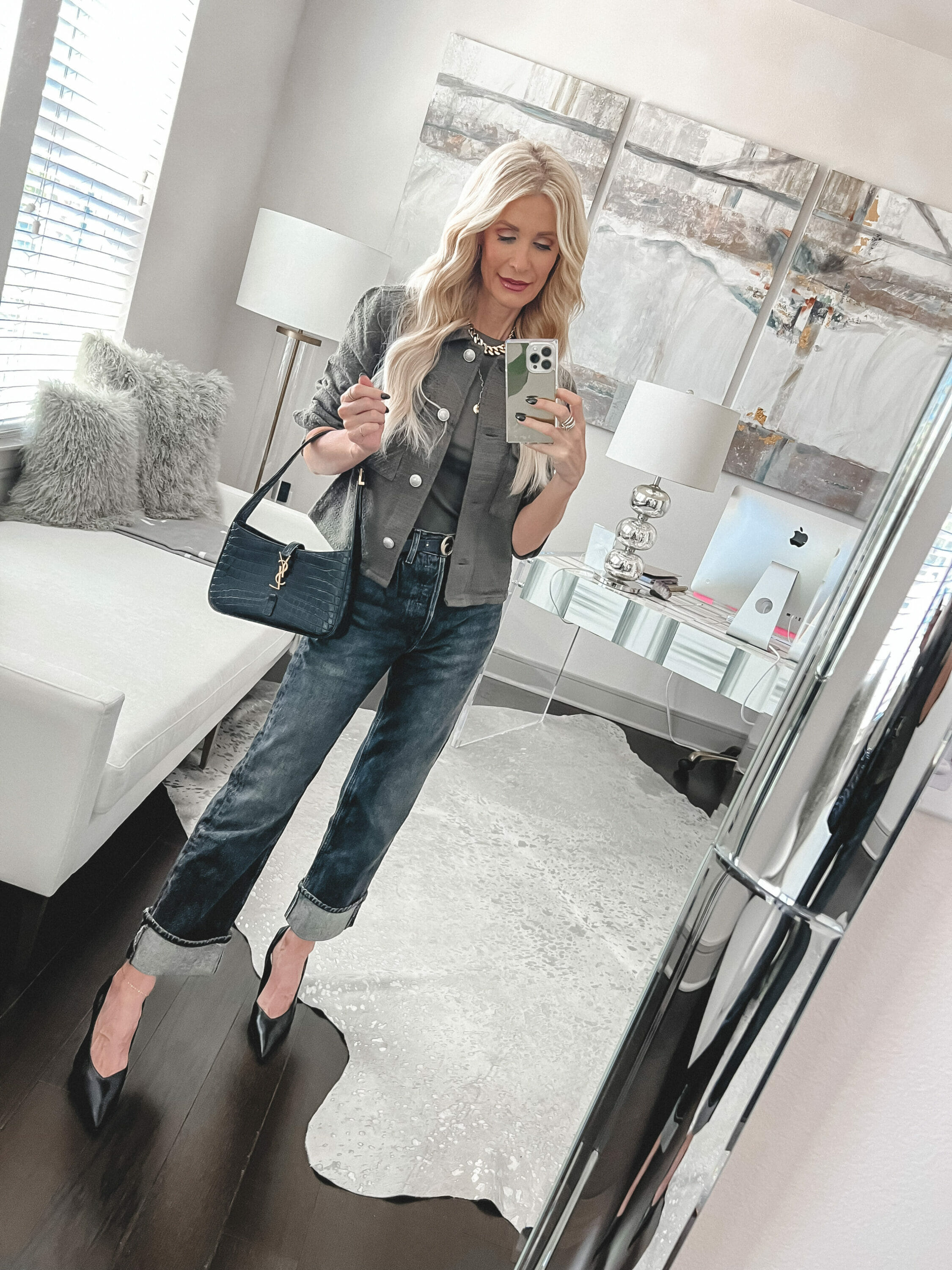 Over 40 fashion stylist from Dallas wearing a tweed jacket with cropped black wash jeans and sling back heels.